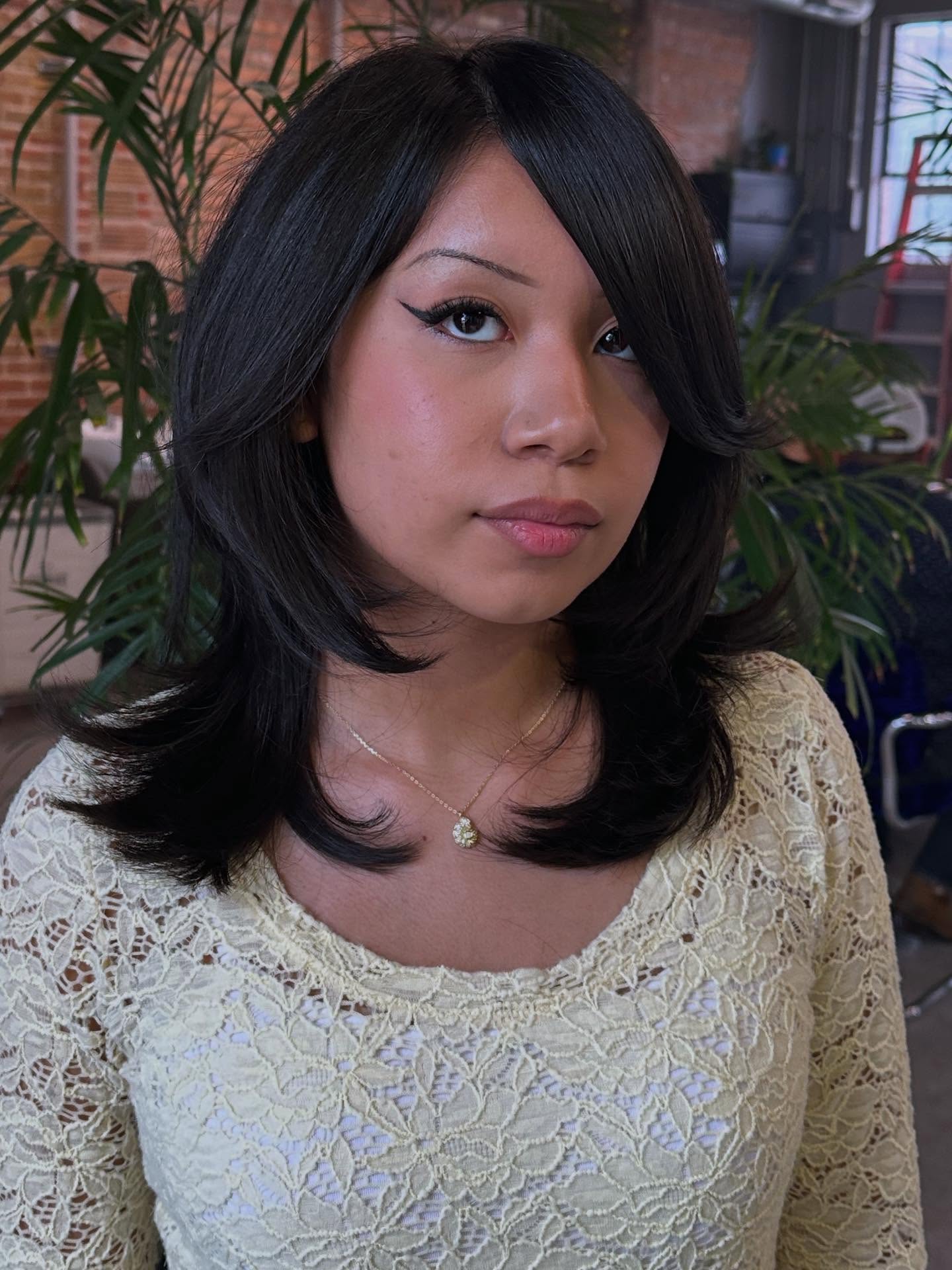 Chic Layered Cut with Dramatic Side Bangs