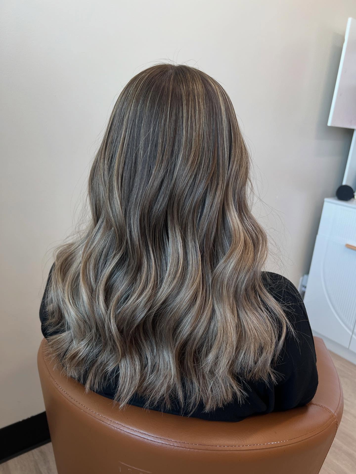 Softly Layered Waves with Warm Ash Blonde Highlights