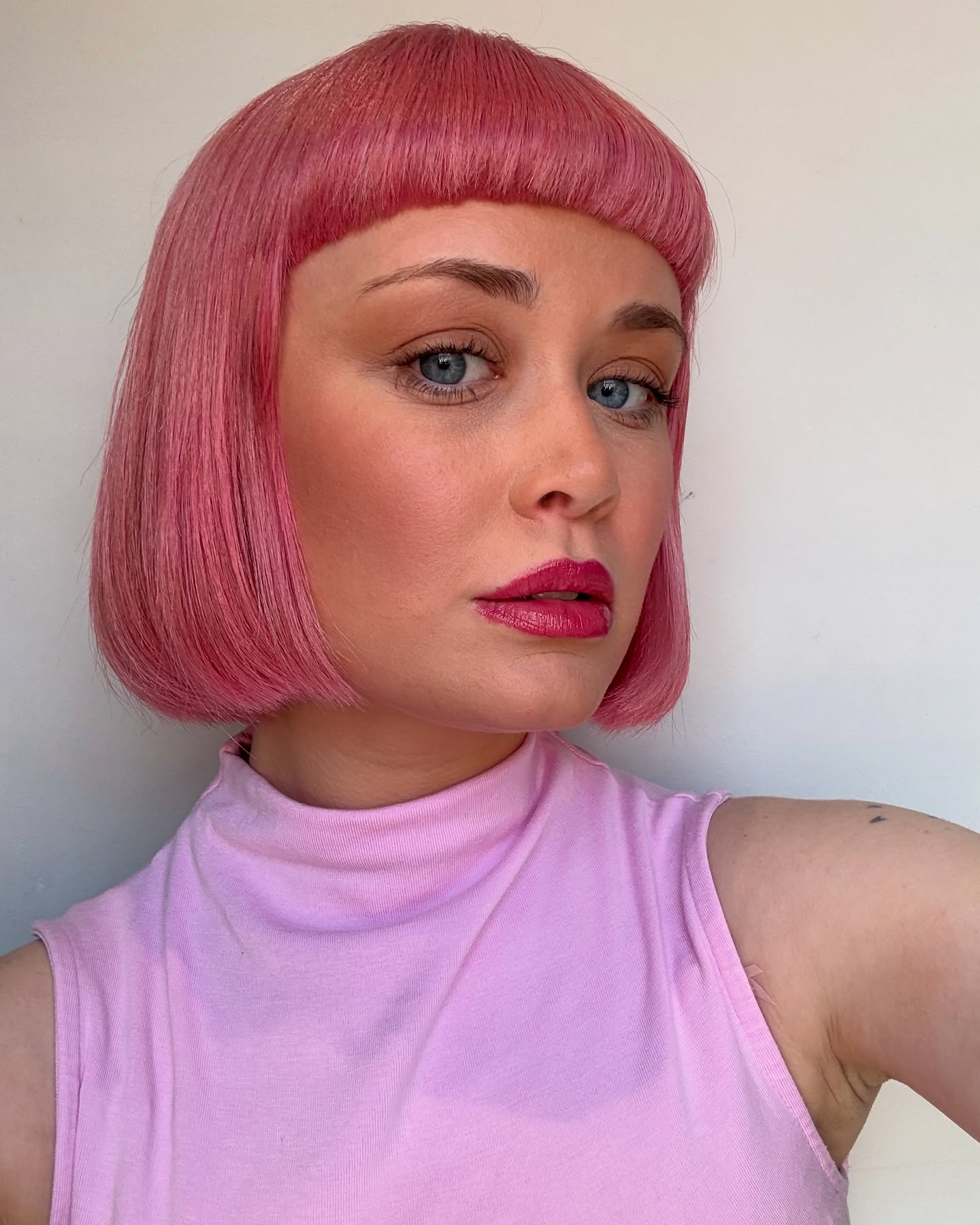 Trendy Blunt Pink Bob with Straight Fringe