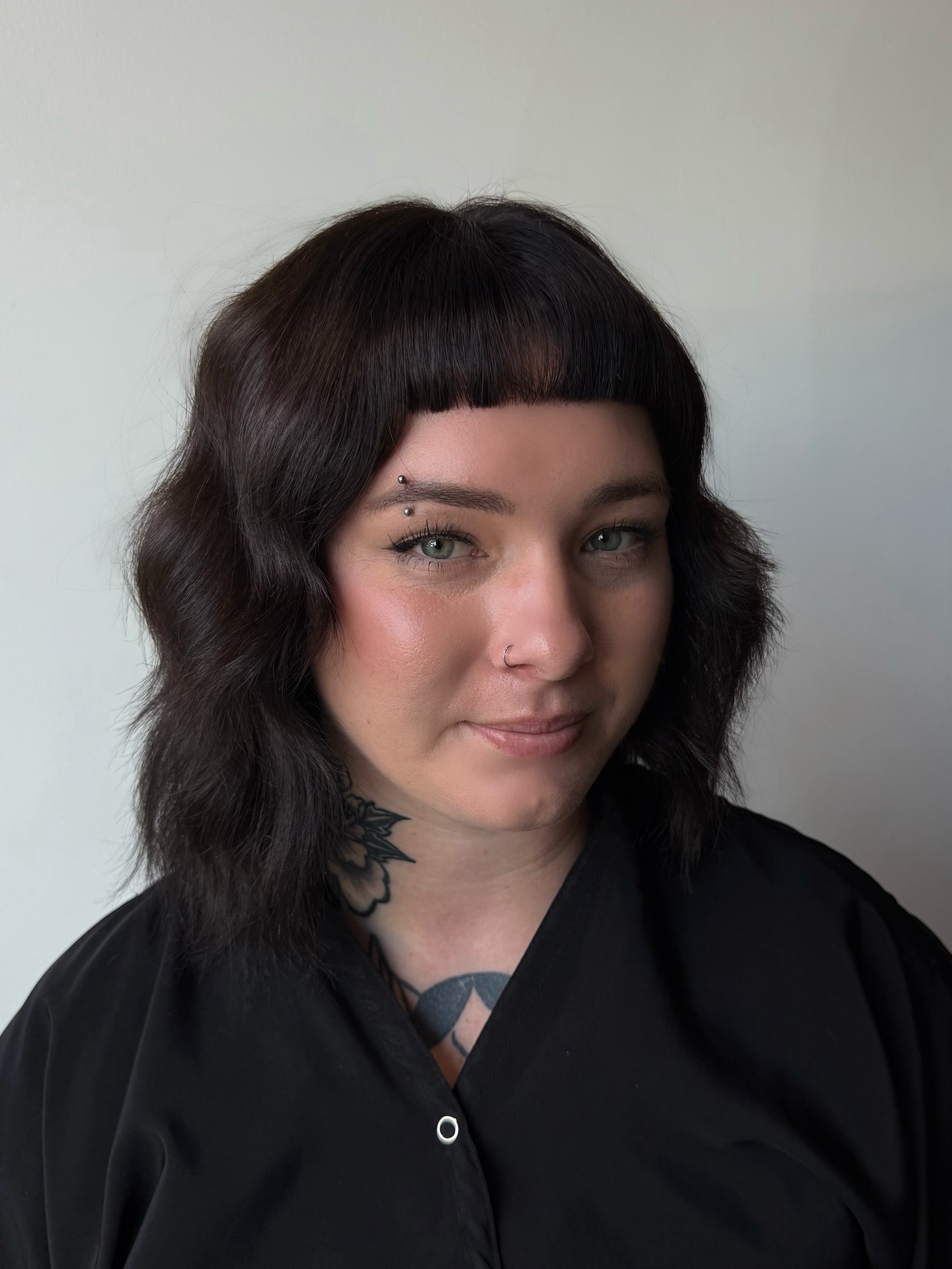 Bold Textured Shoulder-Length Cut with Blunt Bangs