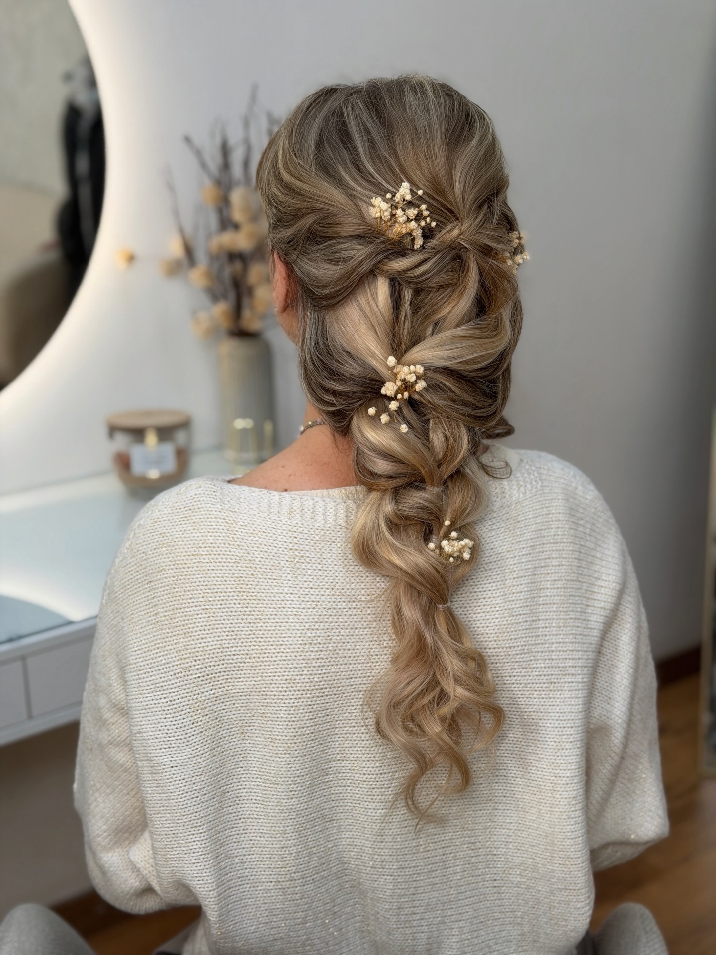 Chic Braided Half-Up Style with Delicate Floral Accents