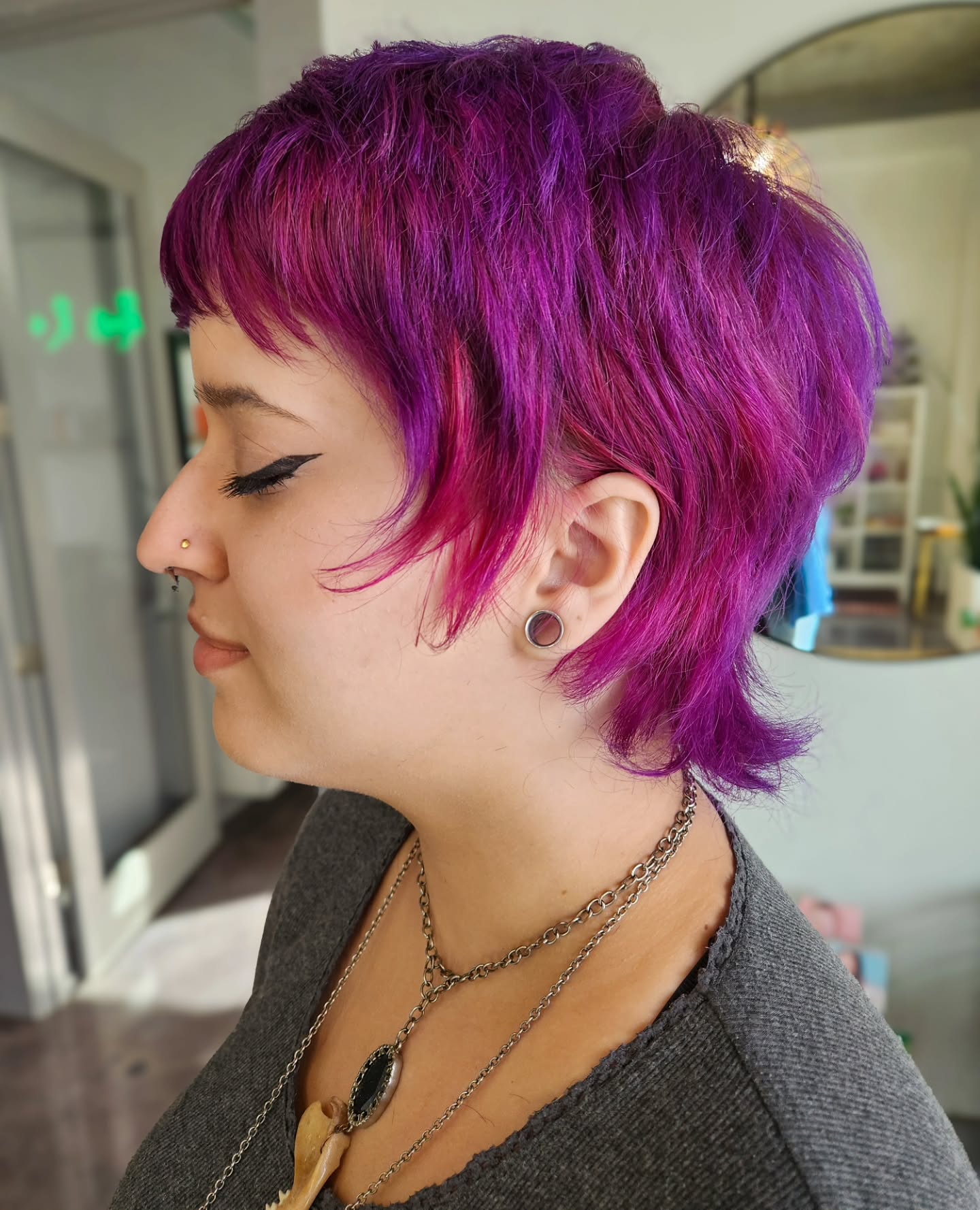 Chic Shaggy Pixie with Vibrant Purple Highlights