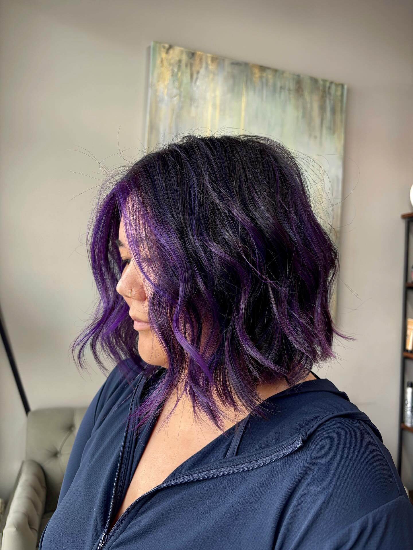 Chic Wavy Bob with Vibrant Purple Highlights
