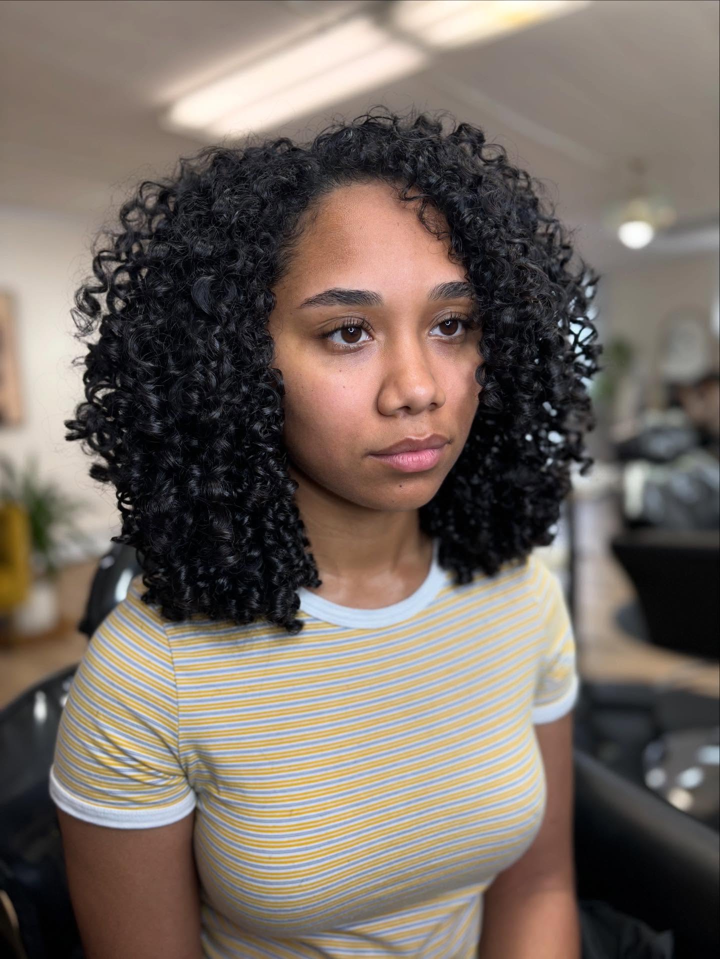 Defined Medium Curly Cut with Natural Volume