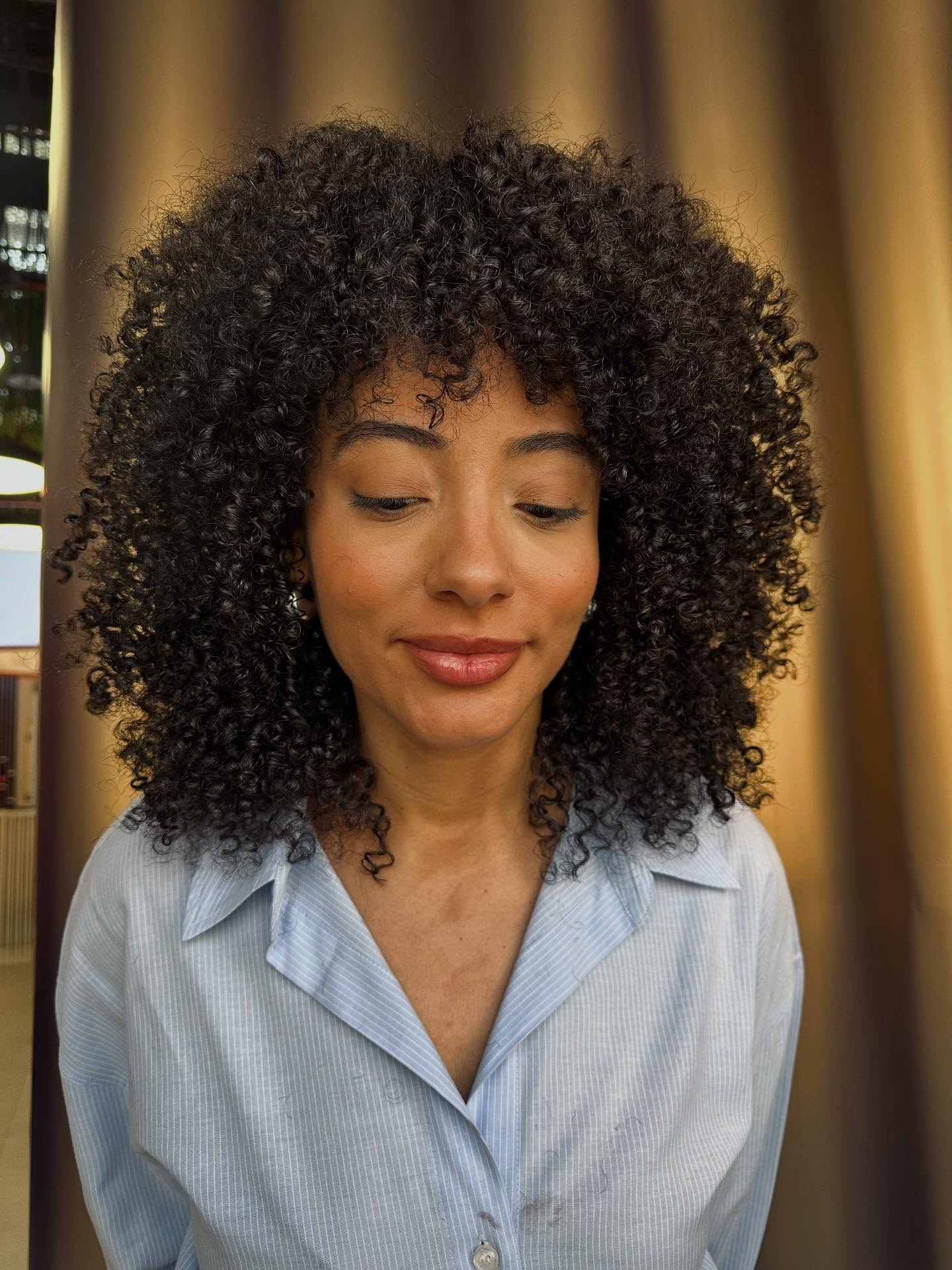 Dynamic Curly Medium Cut with Defined Volume
