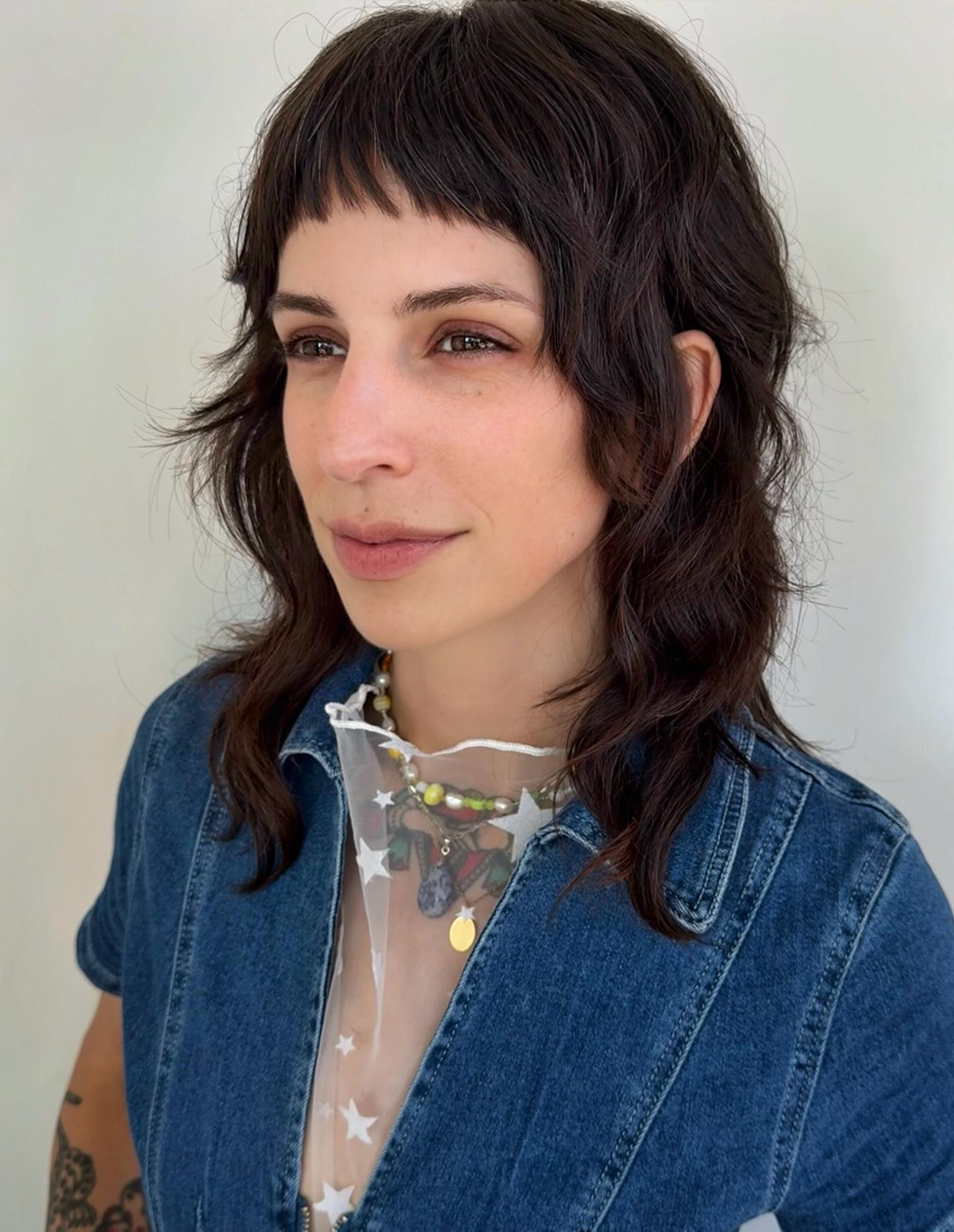 Edgy Textured Shoulder-Length Cut with Baby Bangs