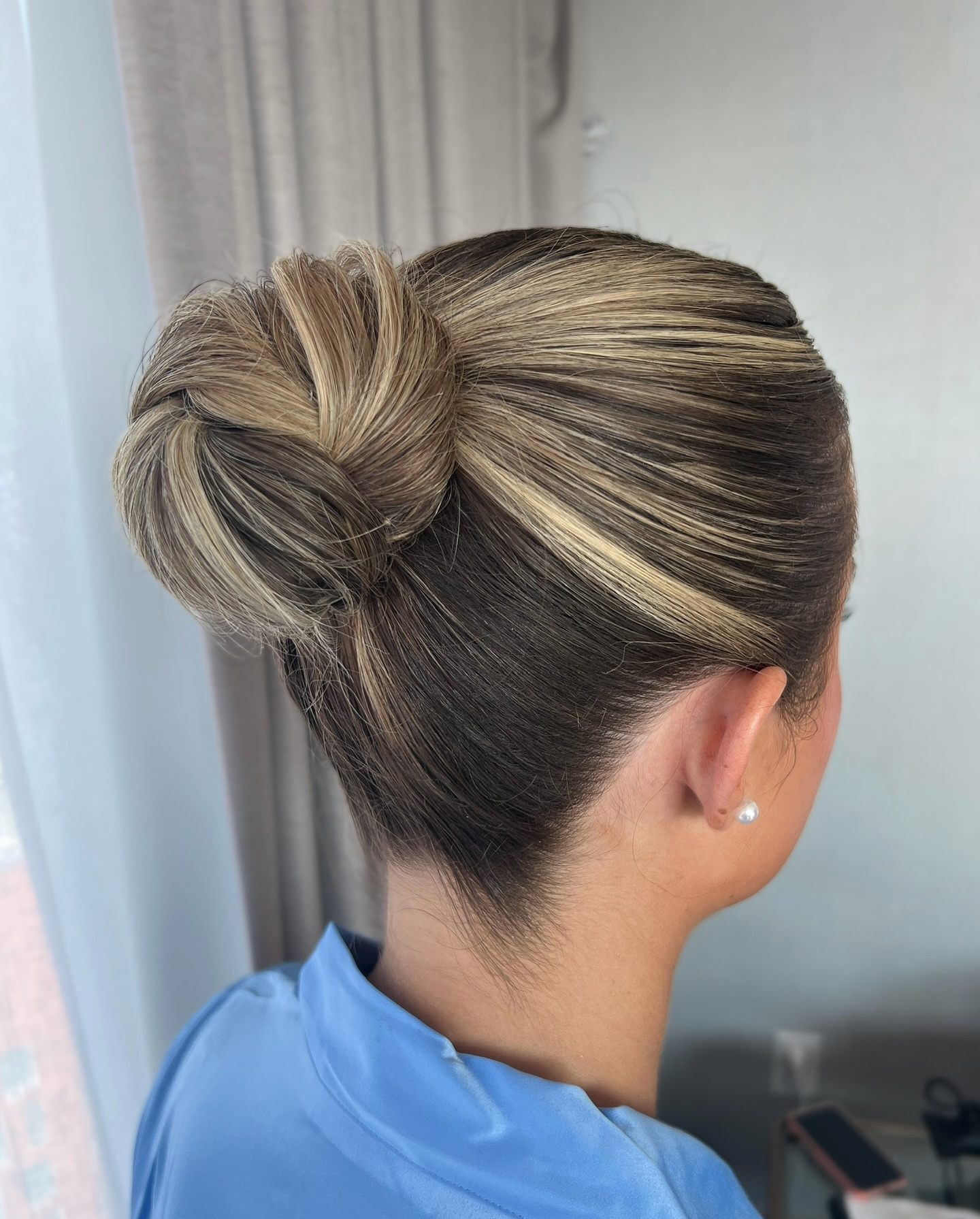 Elegant Sleek Low Bun with Subtle Highlights