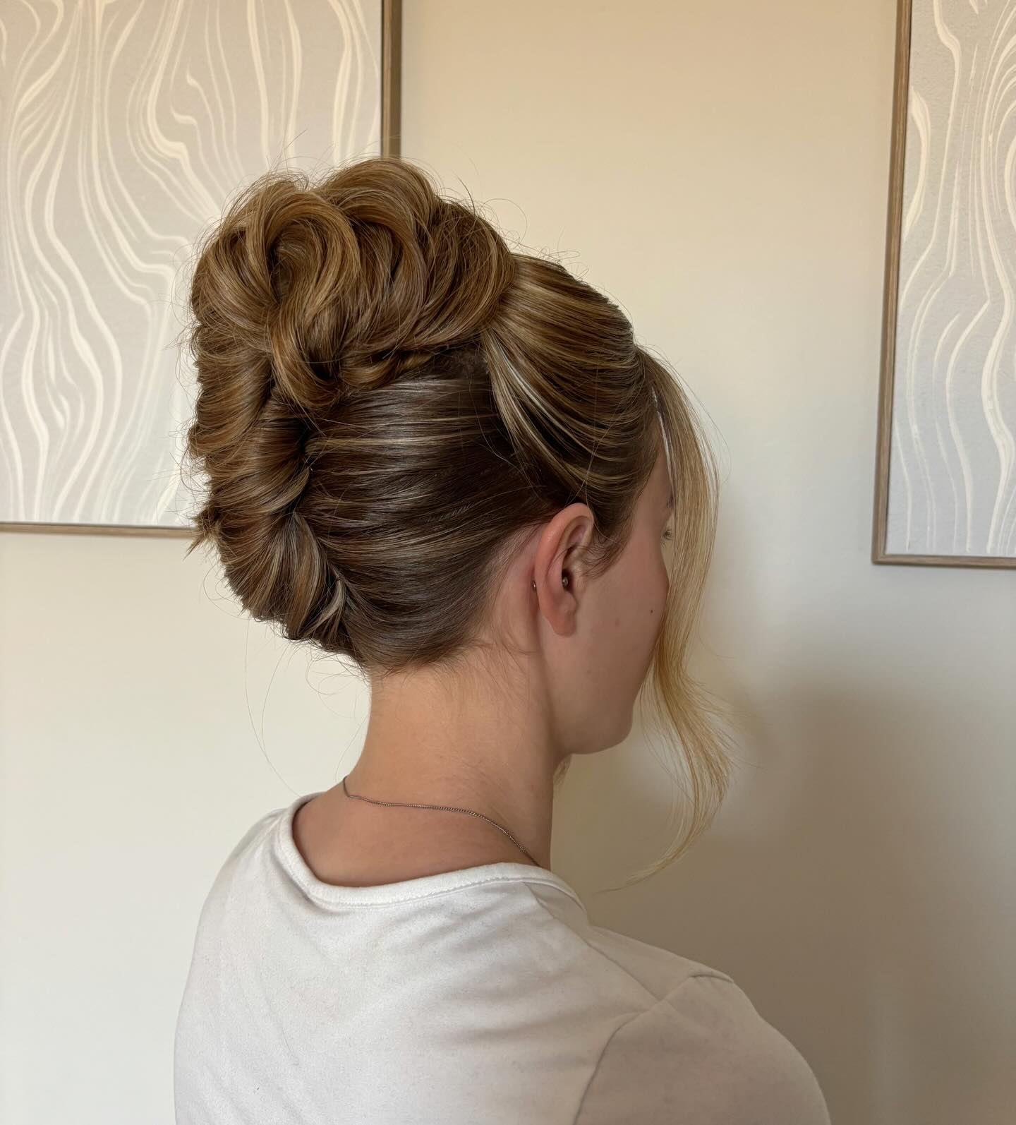 Elegant Twisted Updo with Soft Face-Framing Tendrils
