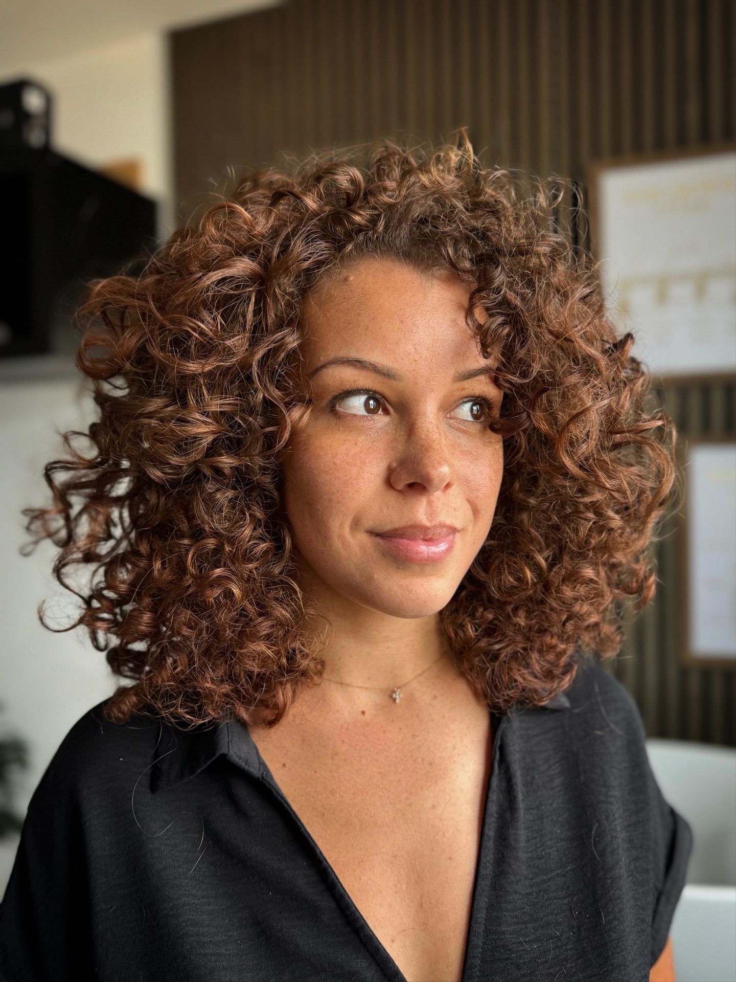 Full-Bodied Curly Shoulder-Length Cut with Natural Bounce