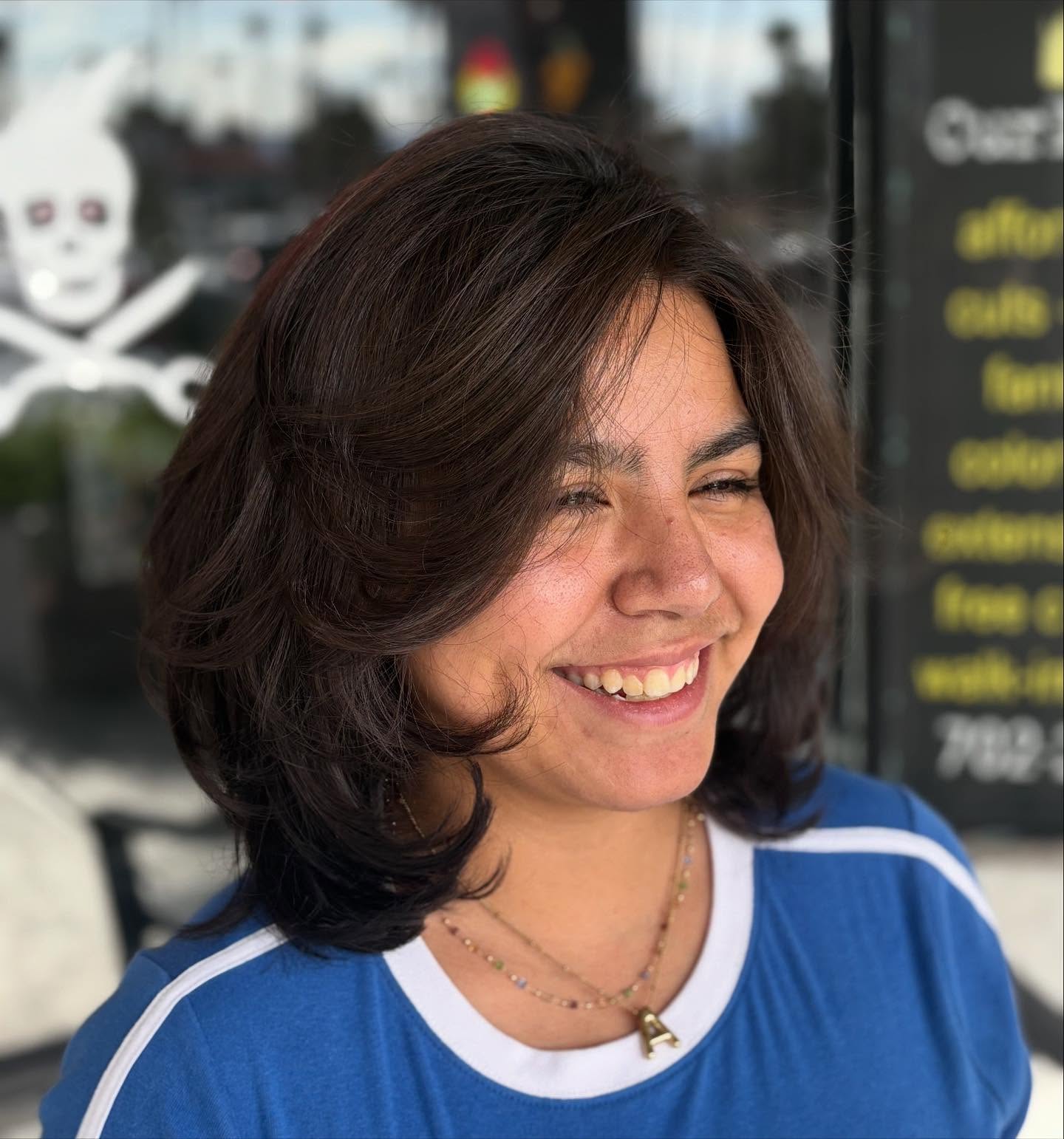 Layered Shoulder-Length Cut with Soft Face-Framing Bangs
