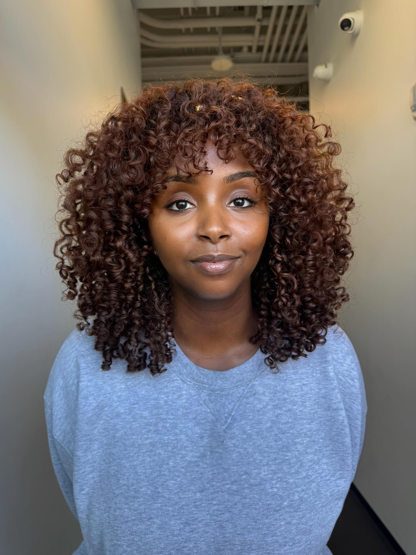 Modern Curly Cut with Defined Volume and Face-Framing Layers