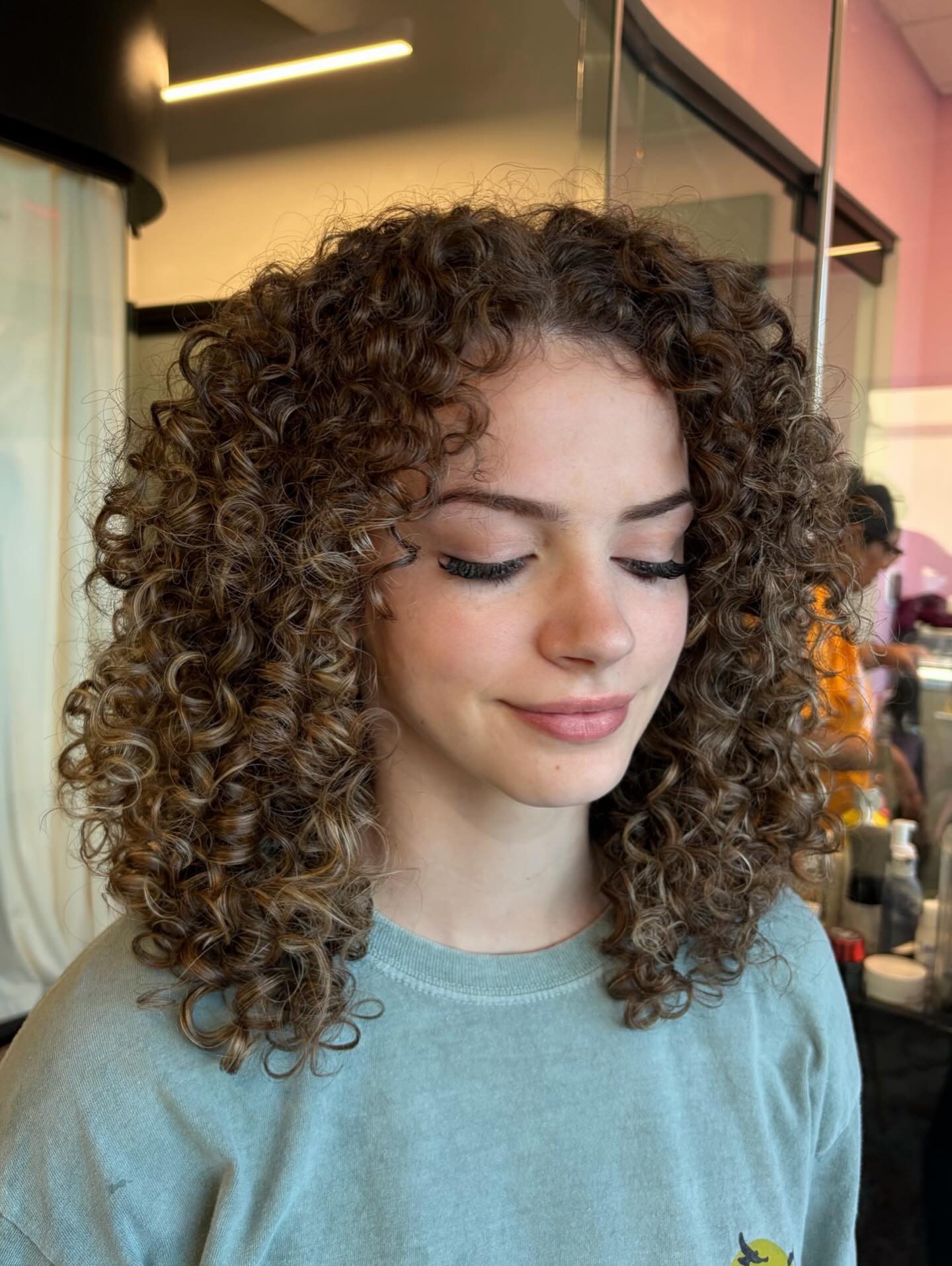 Modern Curly Cut with Lively Volume