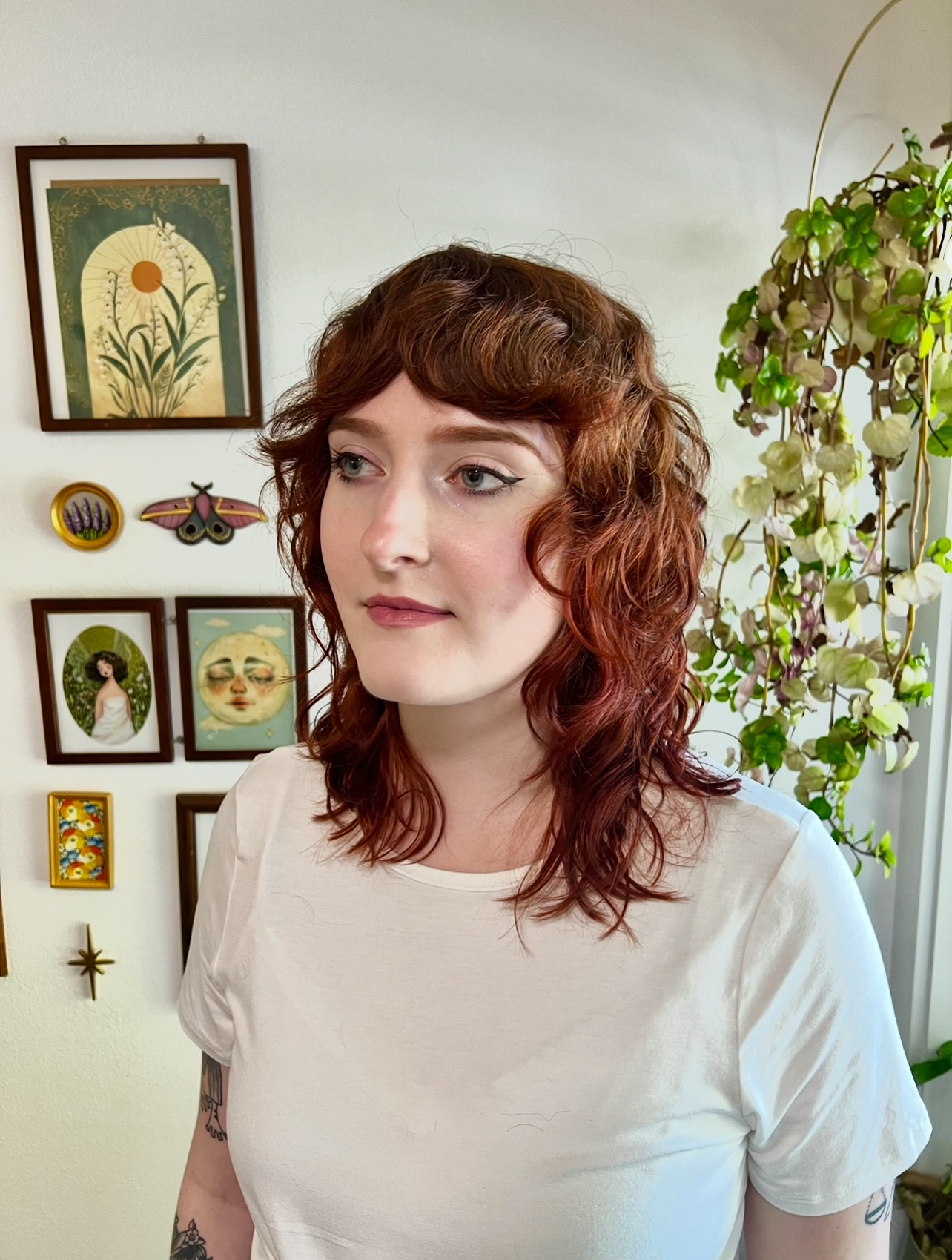 Playful Curly Shoulder-Length Cut with Soft Bangs