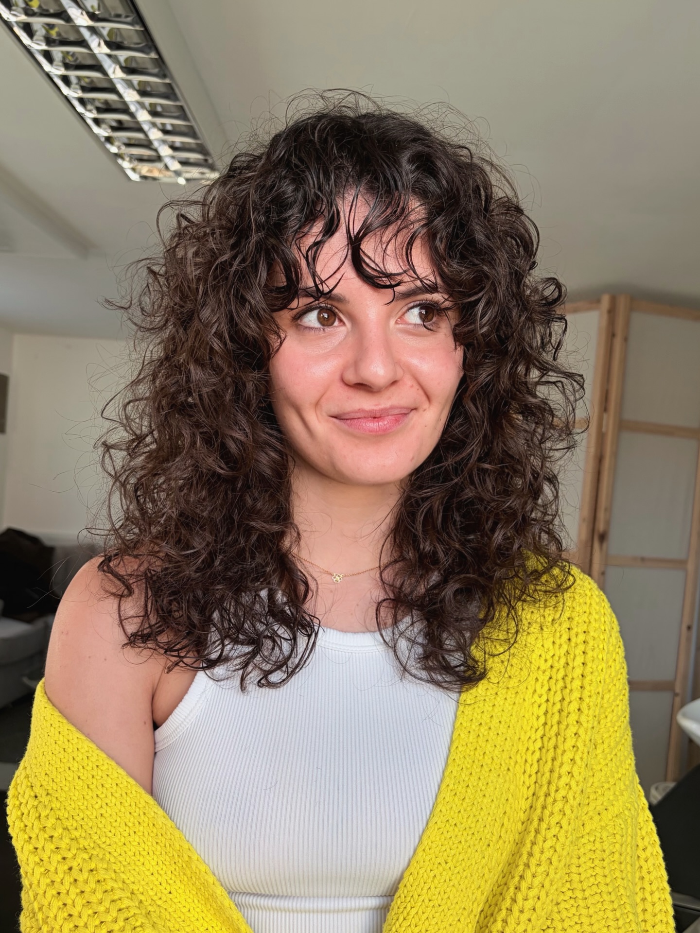 Playful Medium Curly Cut with Soft Face-Framing Layers