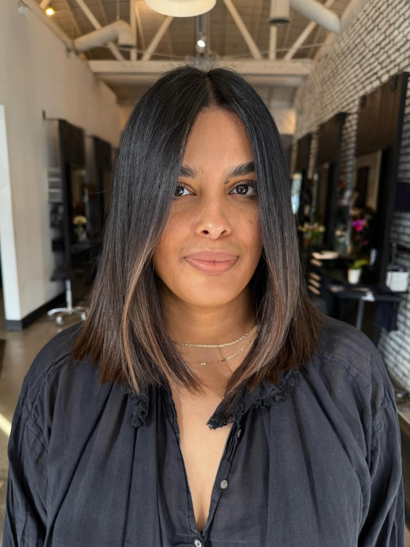 Polished Mid-Length Cut with Subtle Highlights