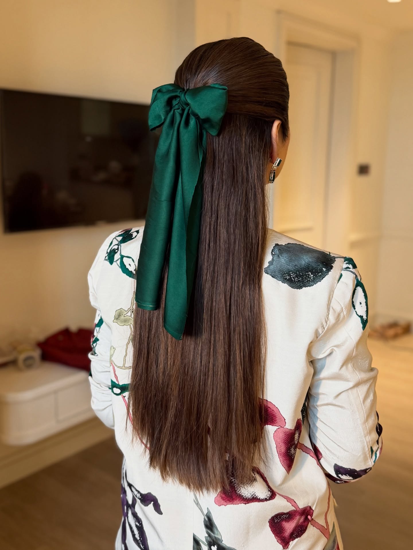 Sleek Half-Back Style with Elegant Green Bow
