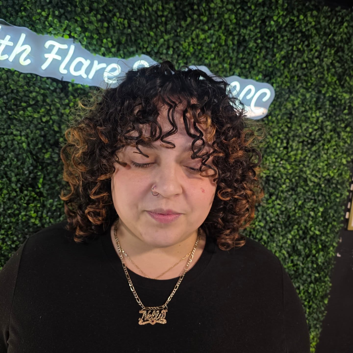 Textured Medium Curly Cut with Warm Highlights