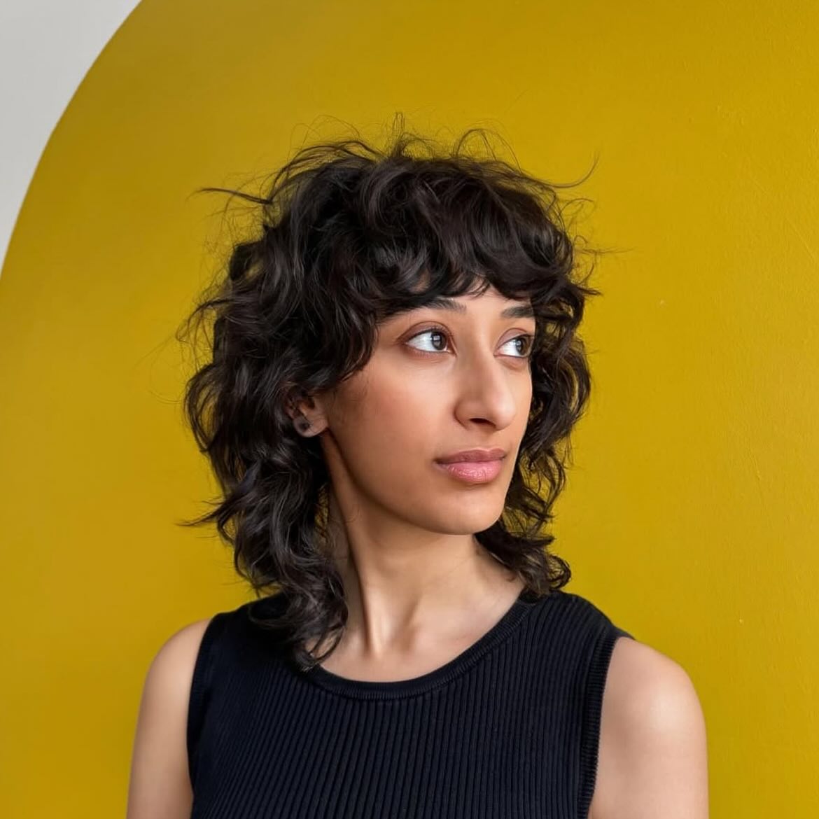 Textured Shag with Defined Curls and Soft Bangs