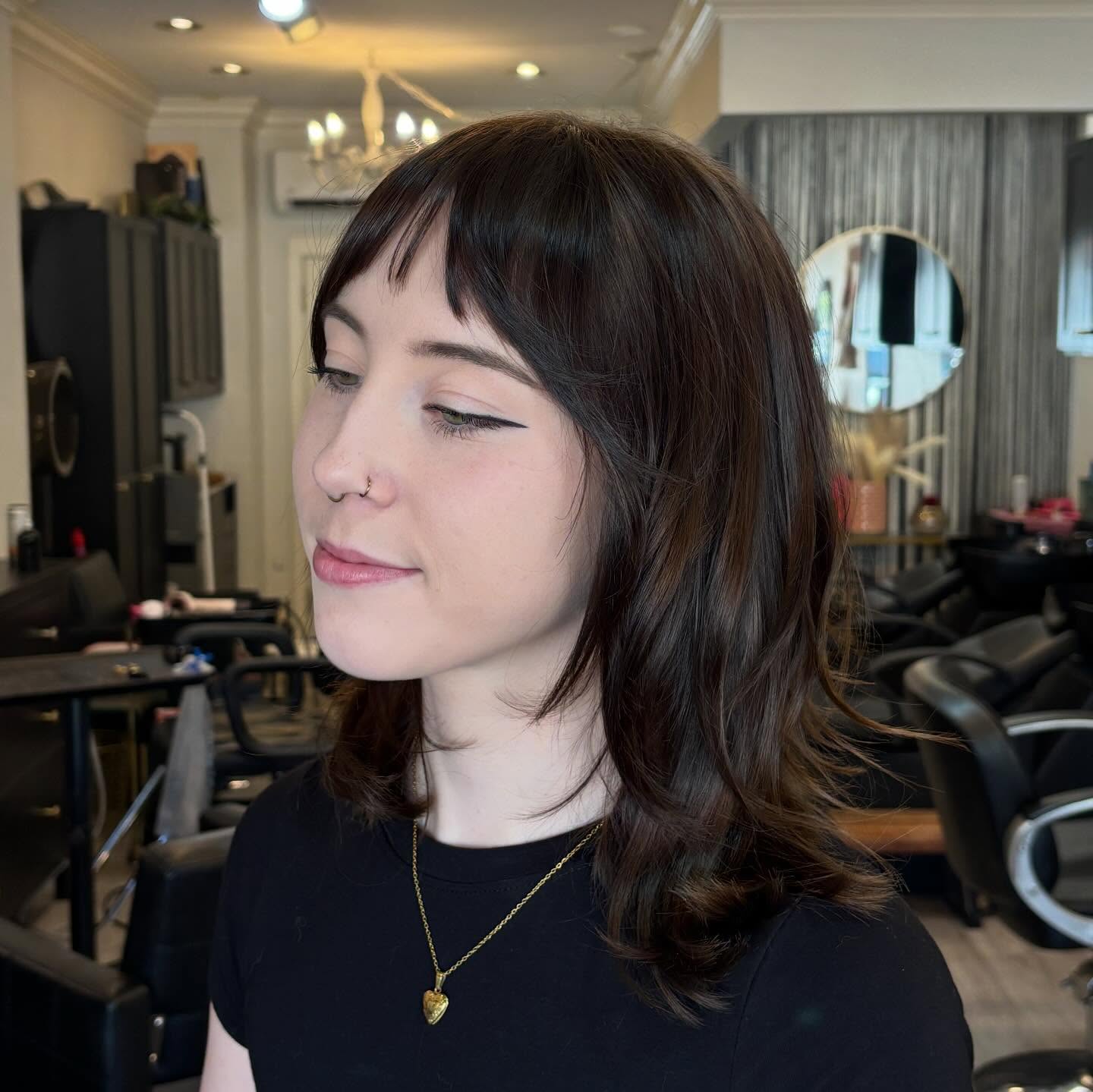 Textured Shoulder-Length Cut with Playful Bangs