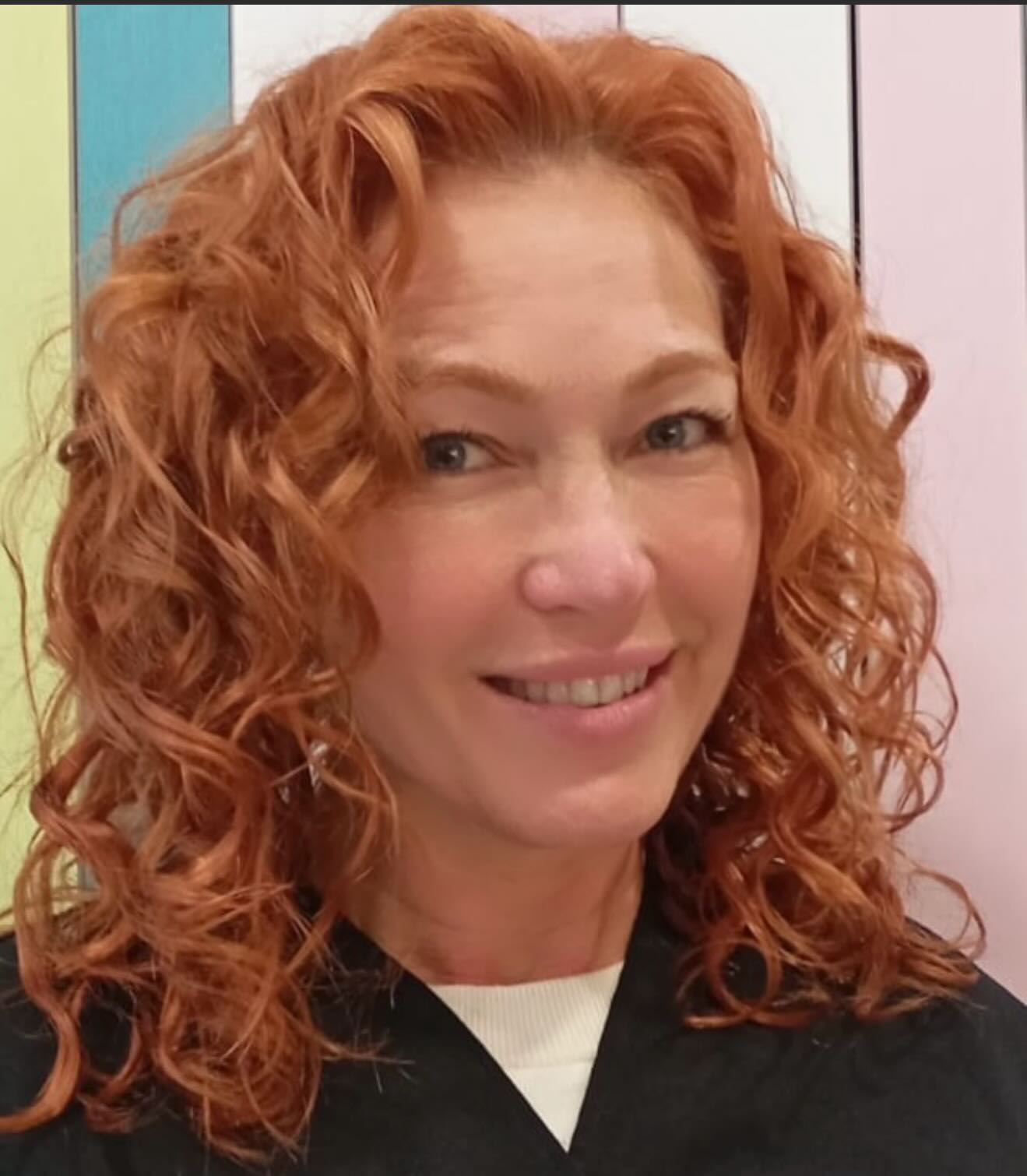 Vibrant Curly Shoulder-Length Cut with Lively Volume
