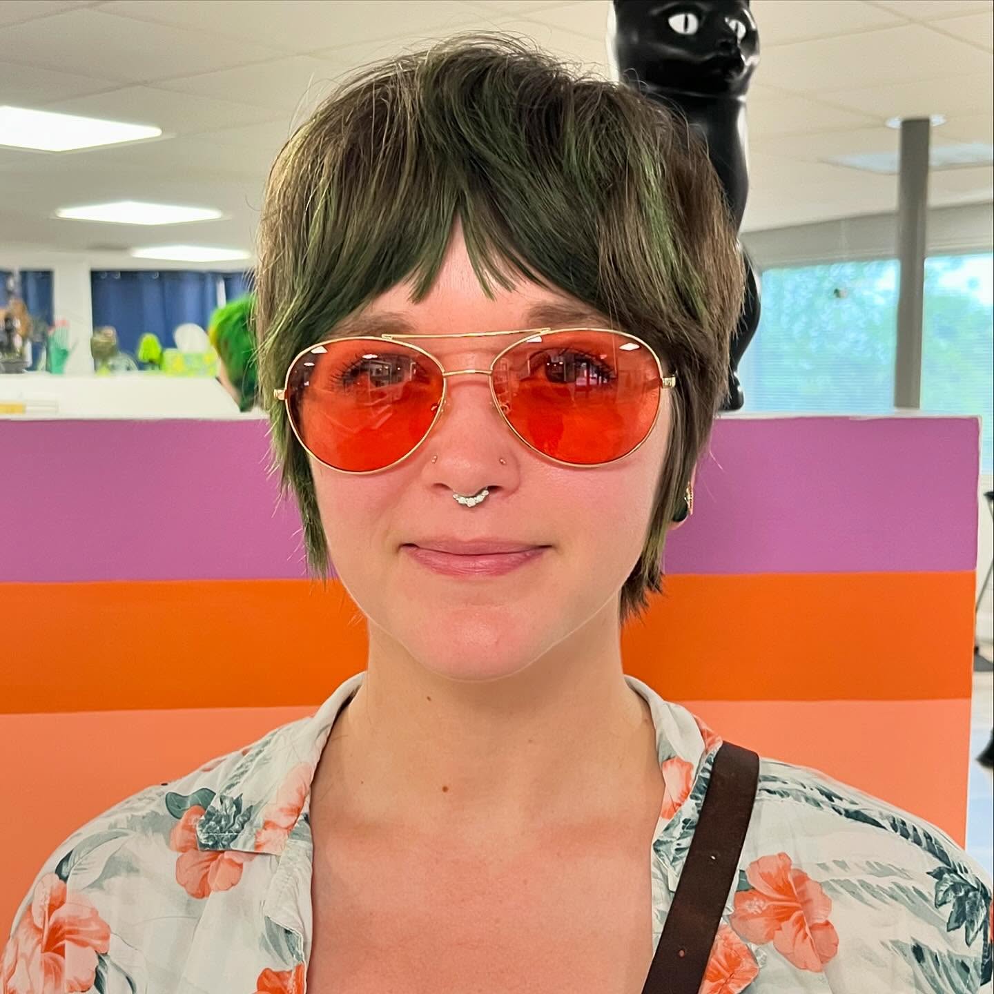 Vibrant Shaggy Pixie with Bold Green Highlights