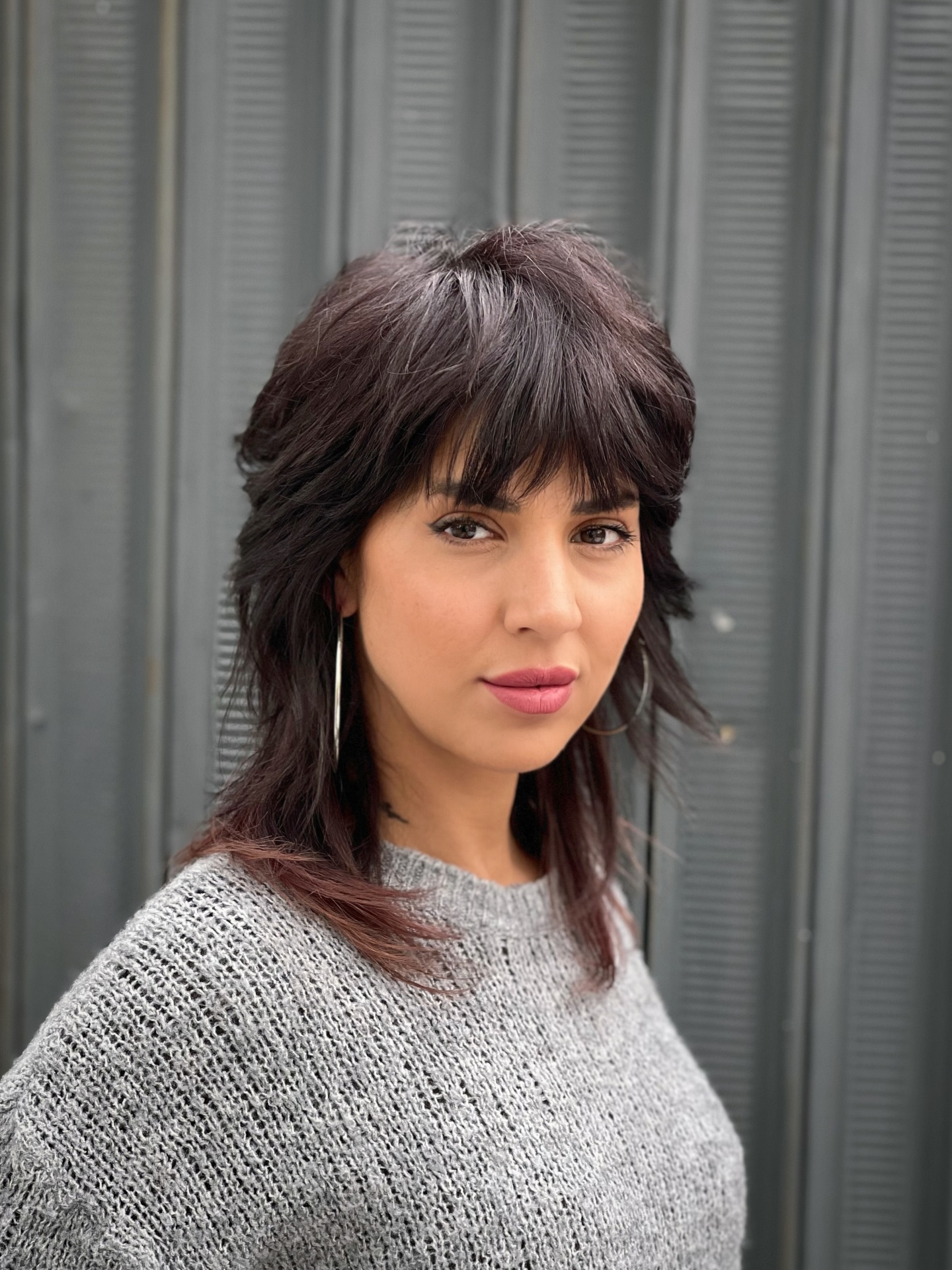 Bold Layered Wolf Cut with Deep Burgundy Accents