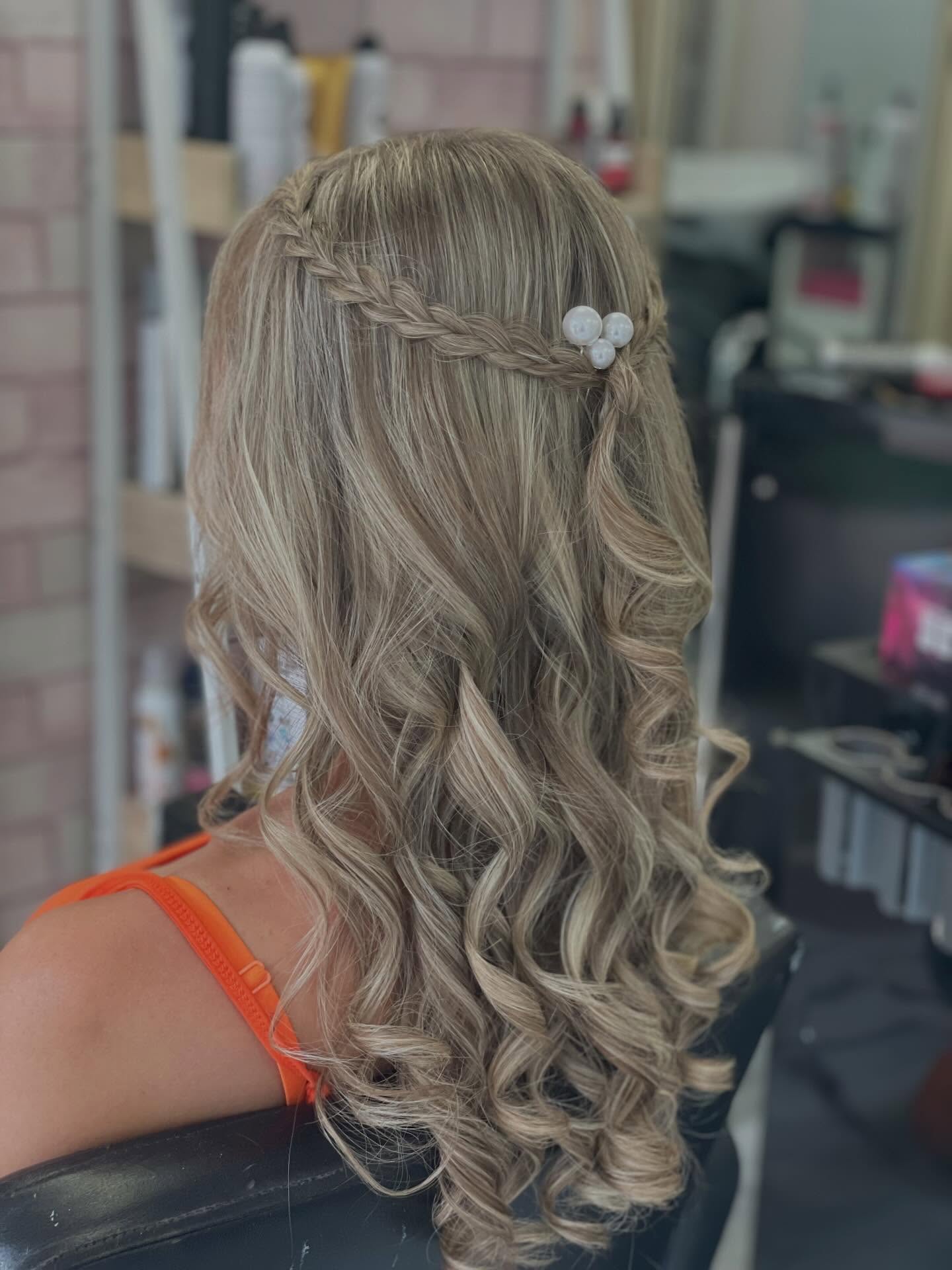 Cascading Curls with Braided Accent