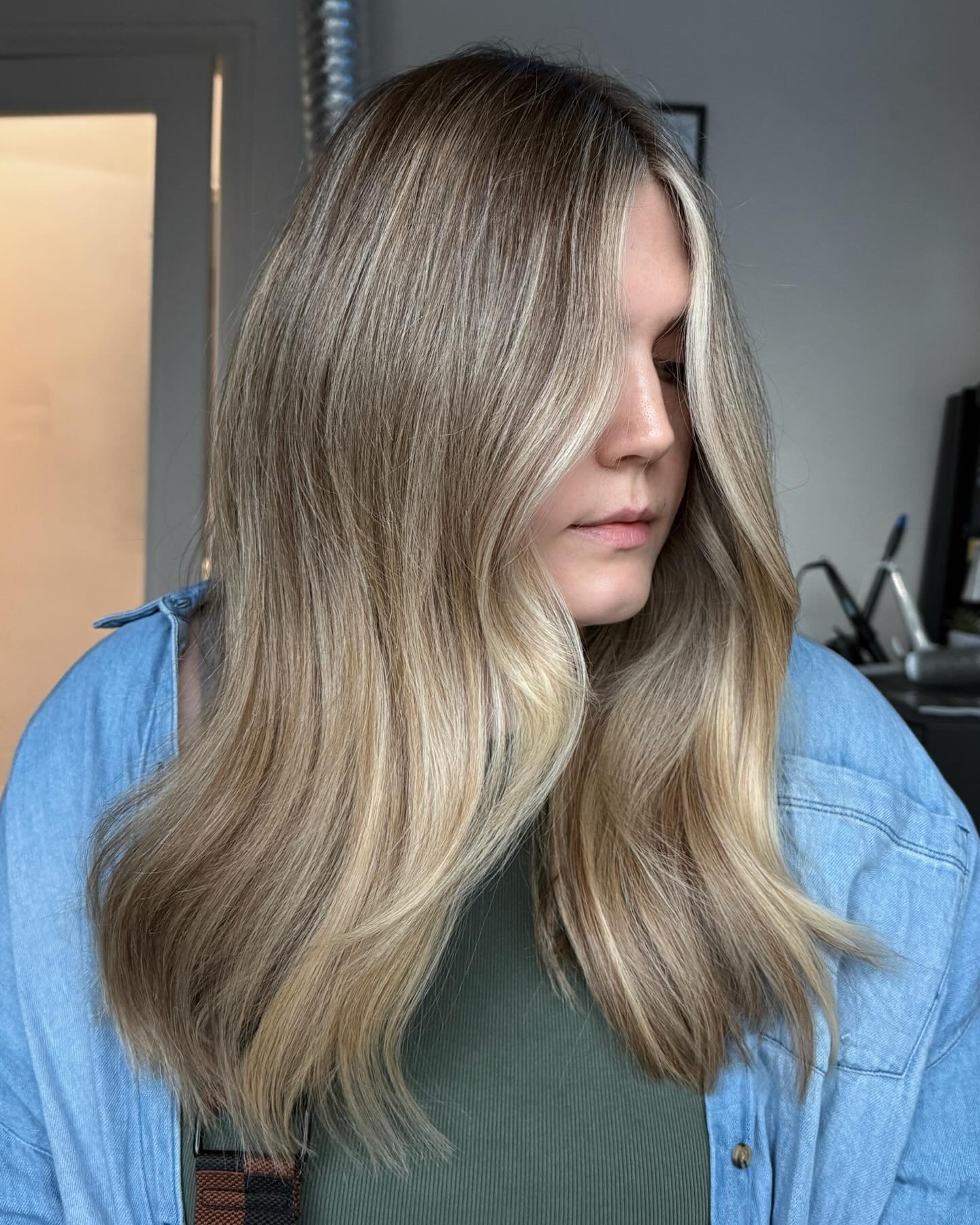 Elegant Long Blonde Waves with Subtle Dimension