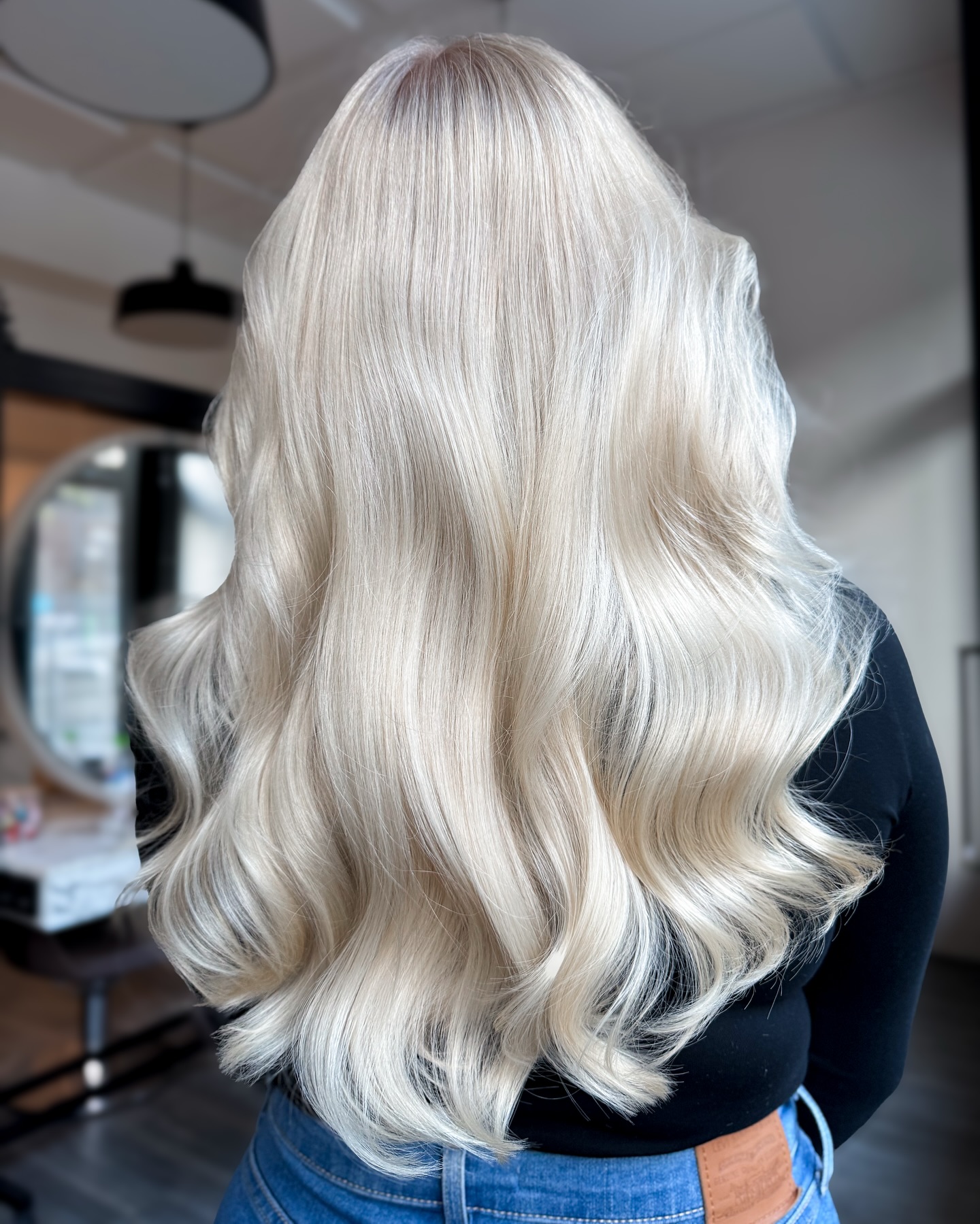 Luxurious Long Blonde Waves with Subtle Dimension