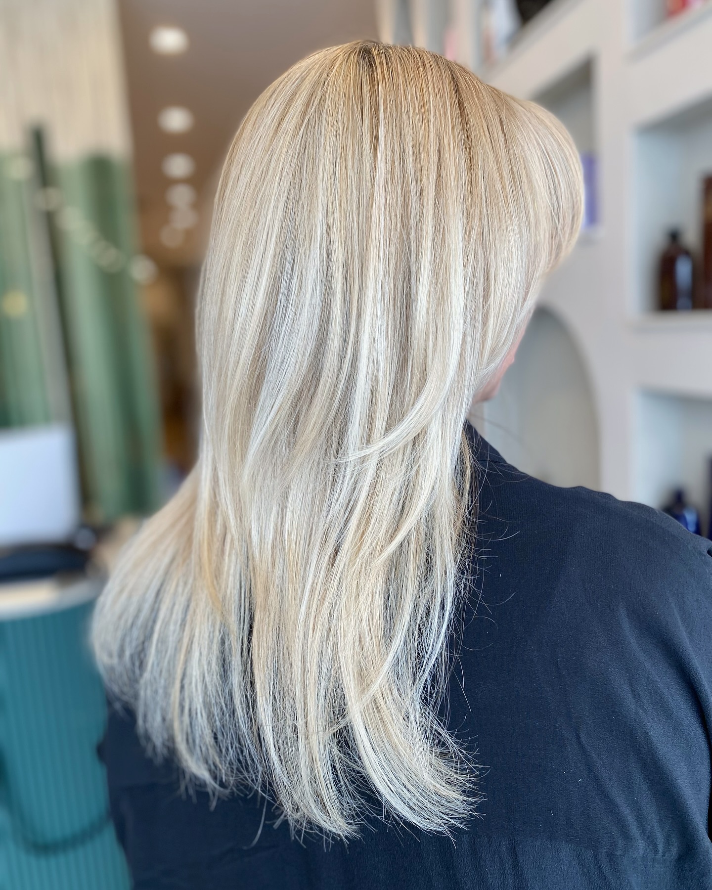 Soft Long Blonde Layers with Face-Framing Bangs