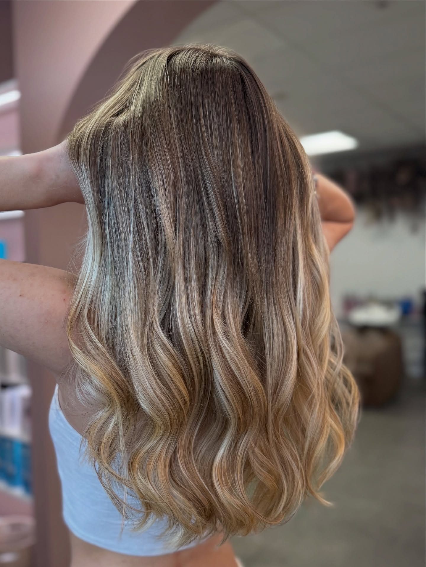Stylish Long Blonde Waves with Luminous Highlights