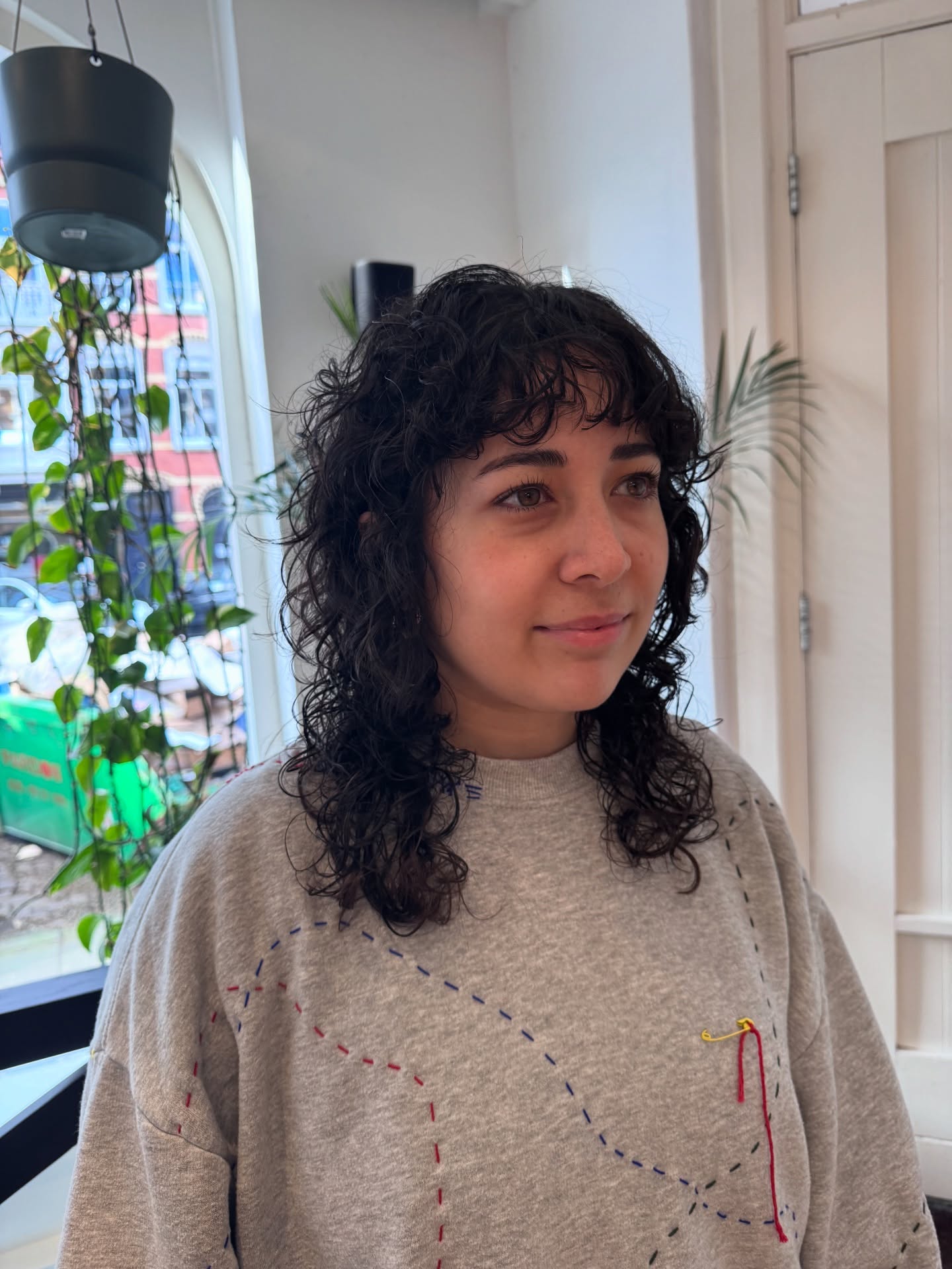 Textured Curly Medium Cut with Soft Curtain Bangs