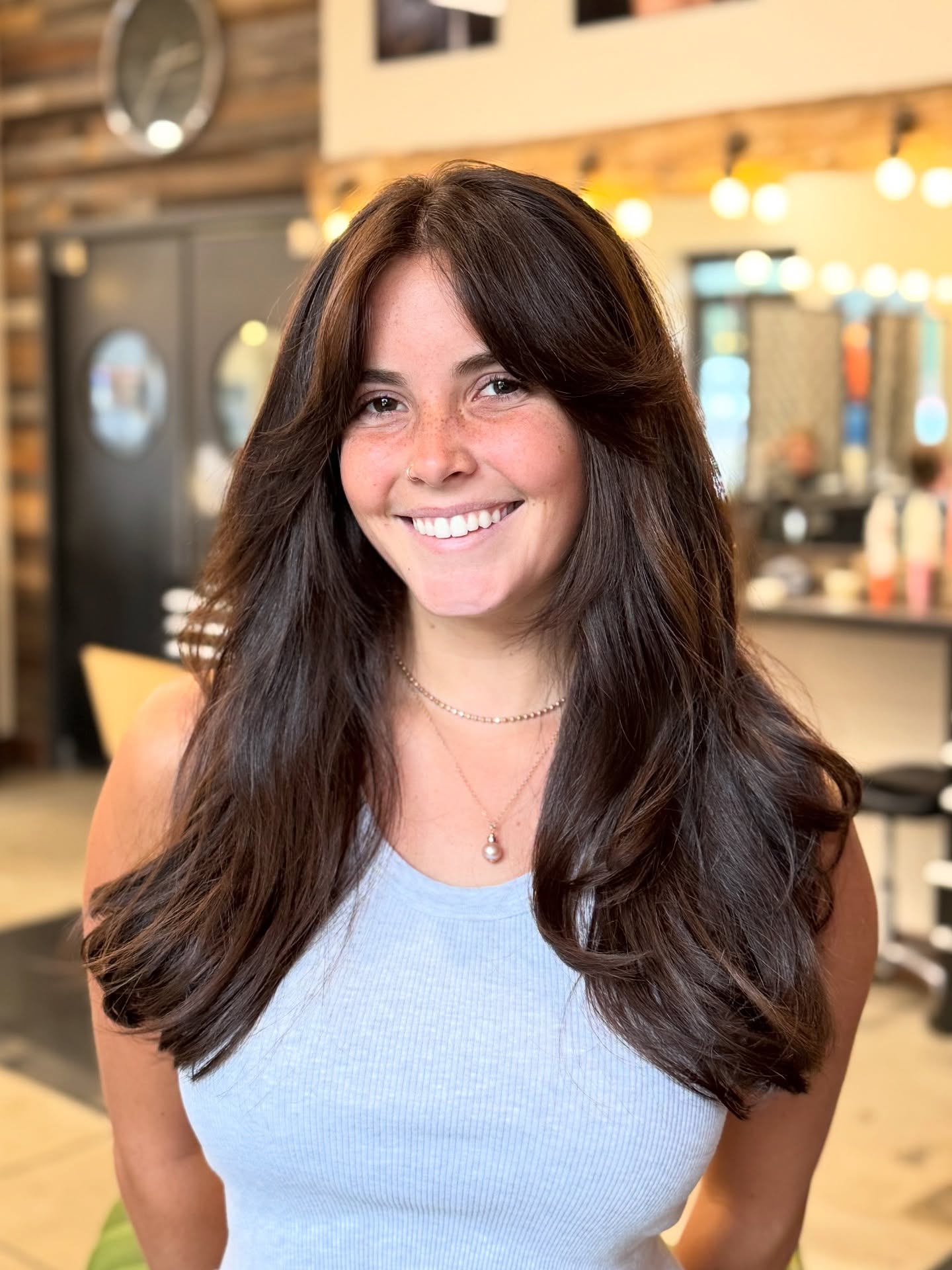 Voluminous Layered Cut with Soft Face Framing