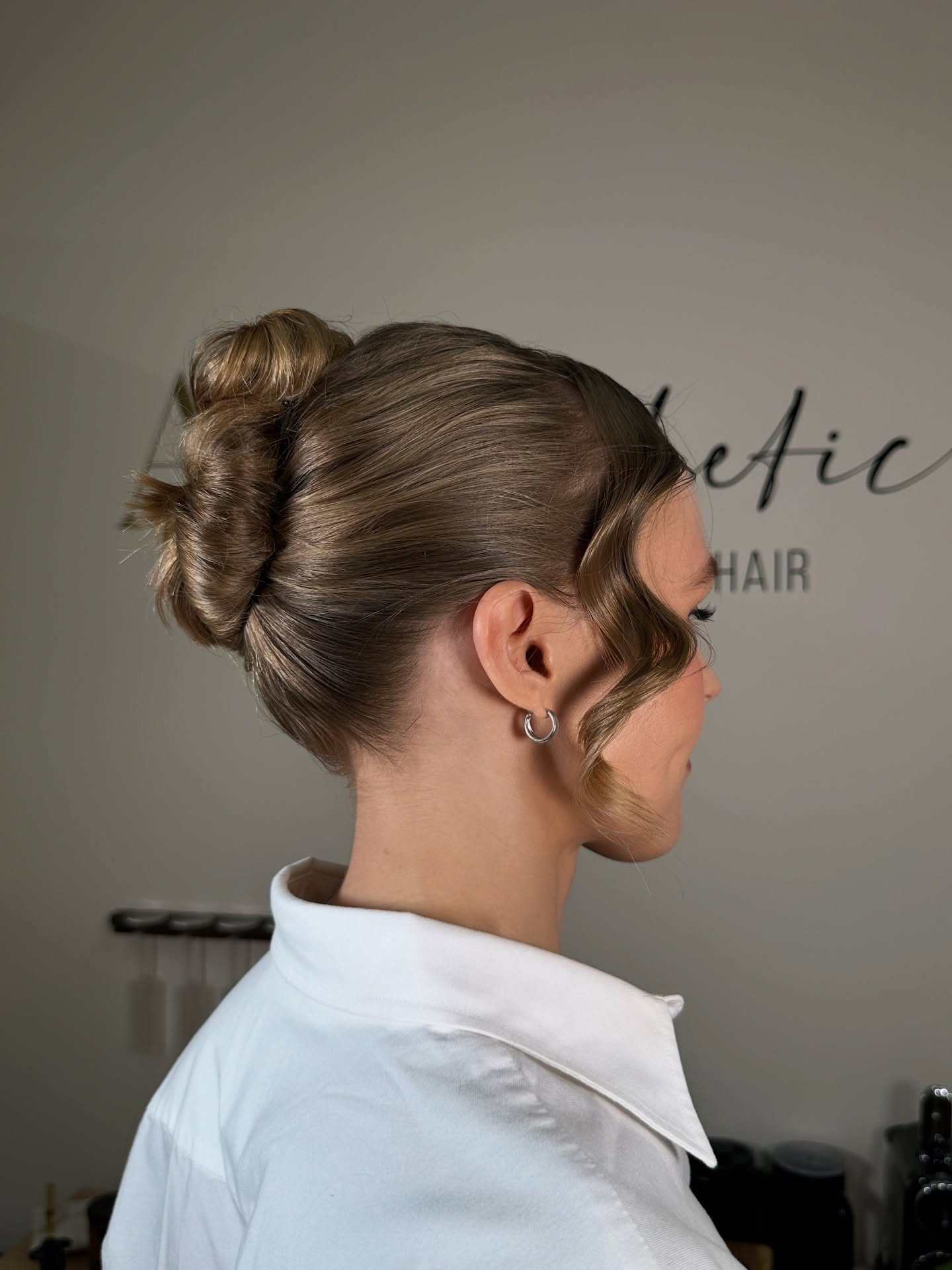 Chic Double Bun with Soft Face-Framing Curls