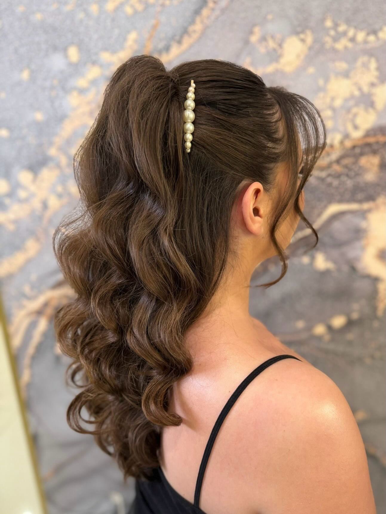 Chic Half-Up Curly Hairstyle with Pearl Accents