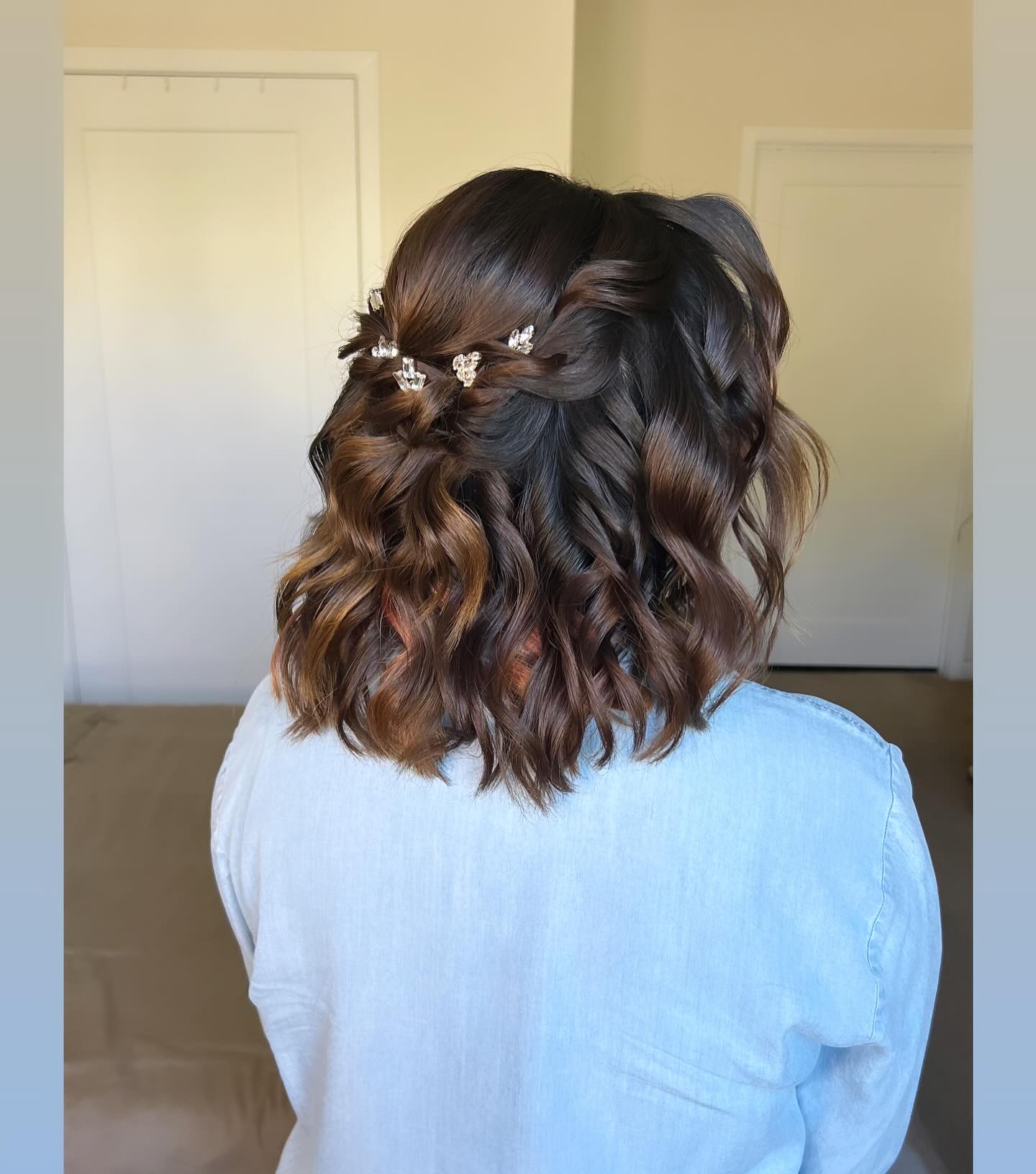 Chic Half-Up Curly Style with Delicate Hair Accessories