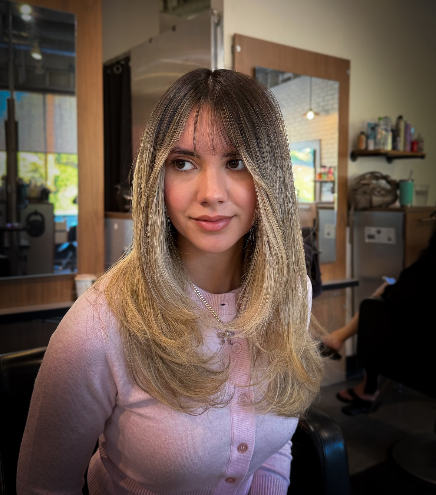 Effortlessly Chic Wispy Bangs with Long Layers