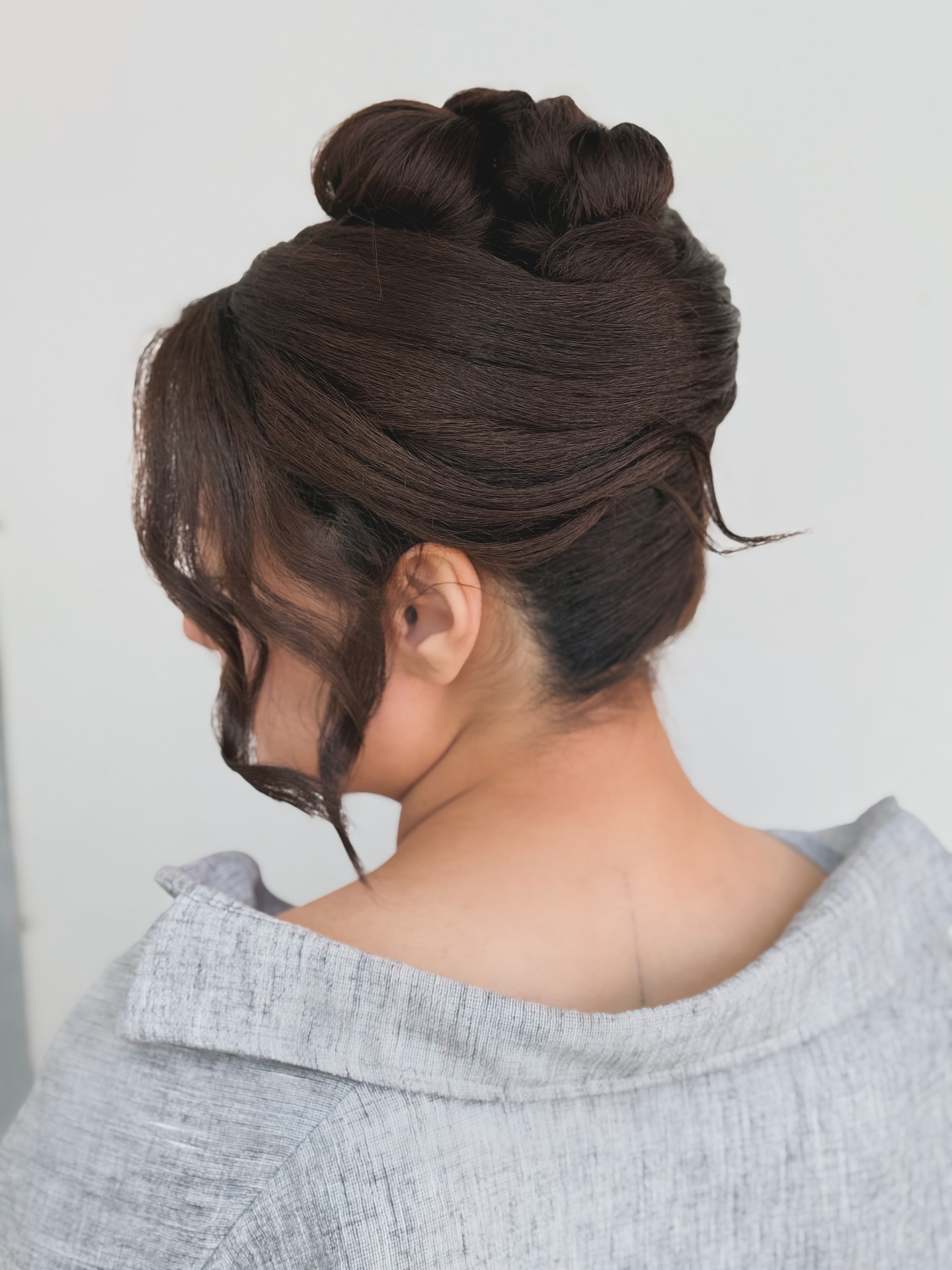 Elegant Twisted Updo with Soft Face Framing Curls