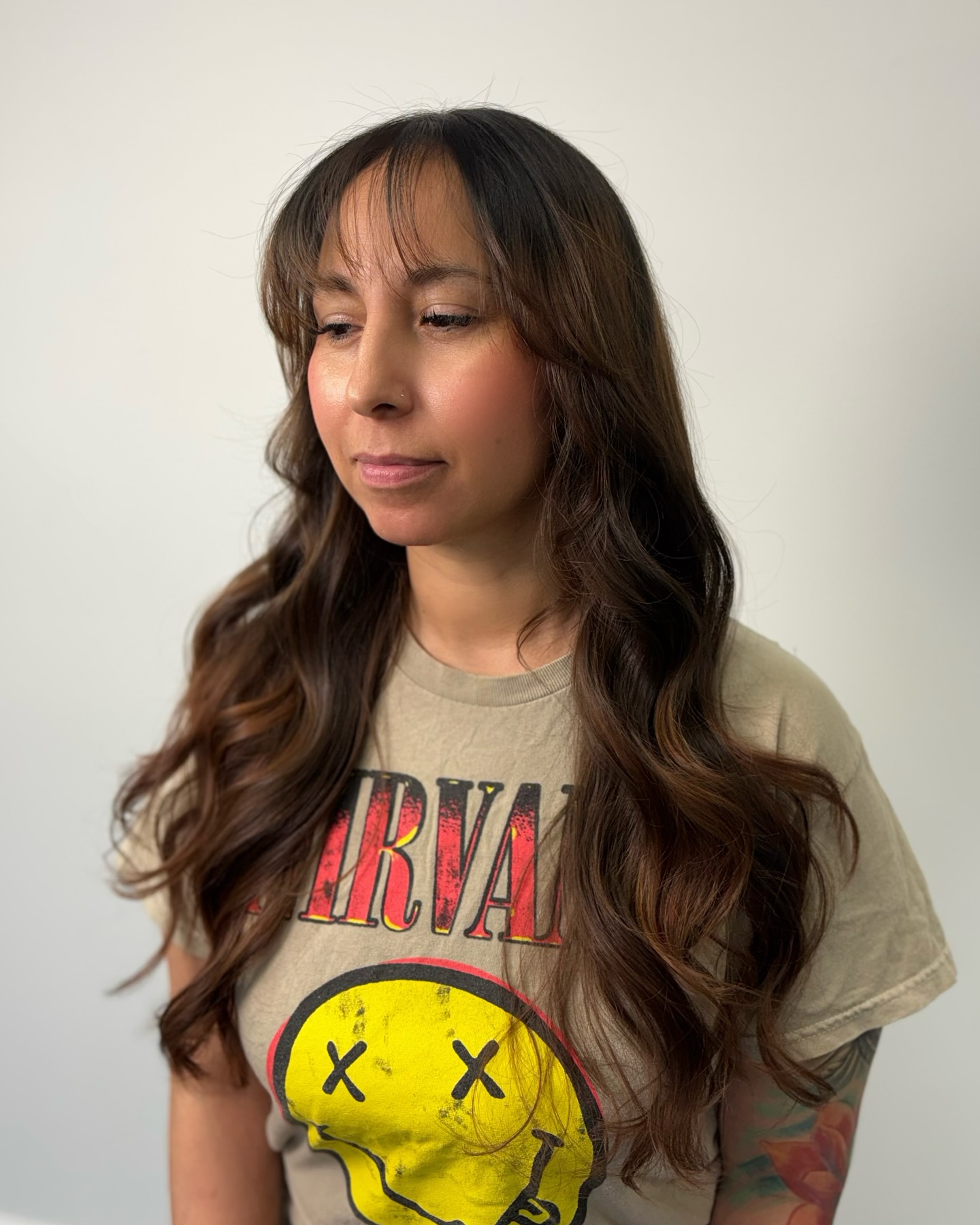 Modern Wispy Bangs with Soft Layered Waves
