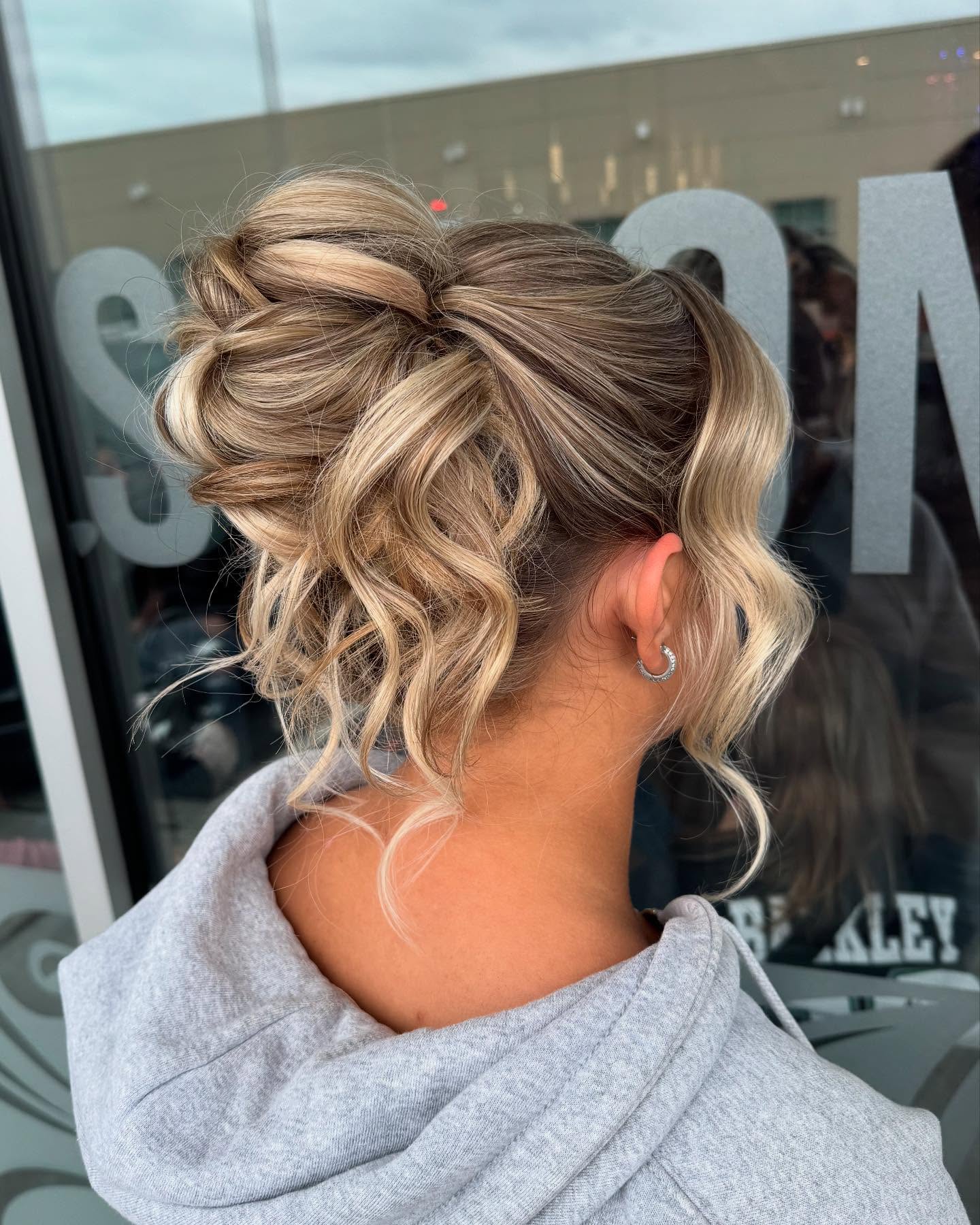 Playful Textured Bun with Loose Curls