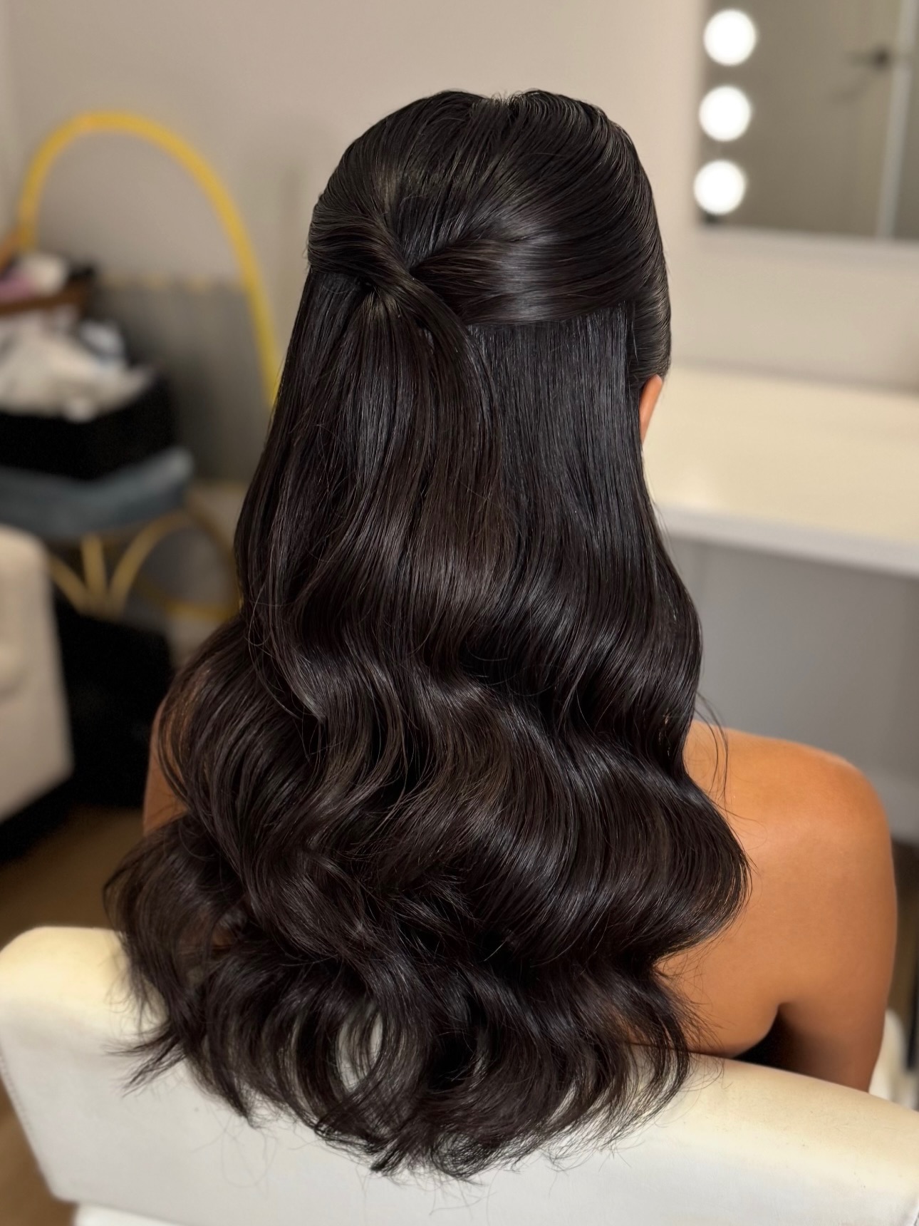 Sleek Half-Up Waves with a Subtle Twist