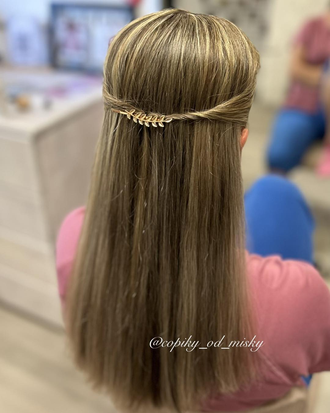 Sleek Long Hair with Twisted Detail and Accent Pin
