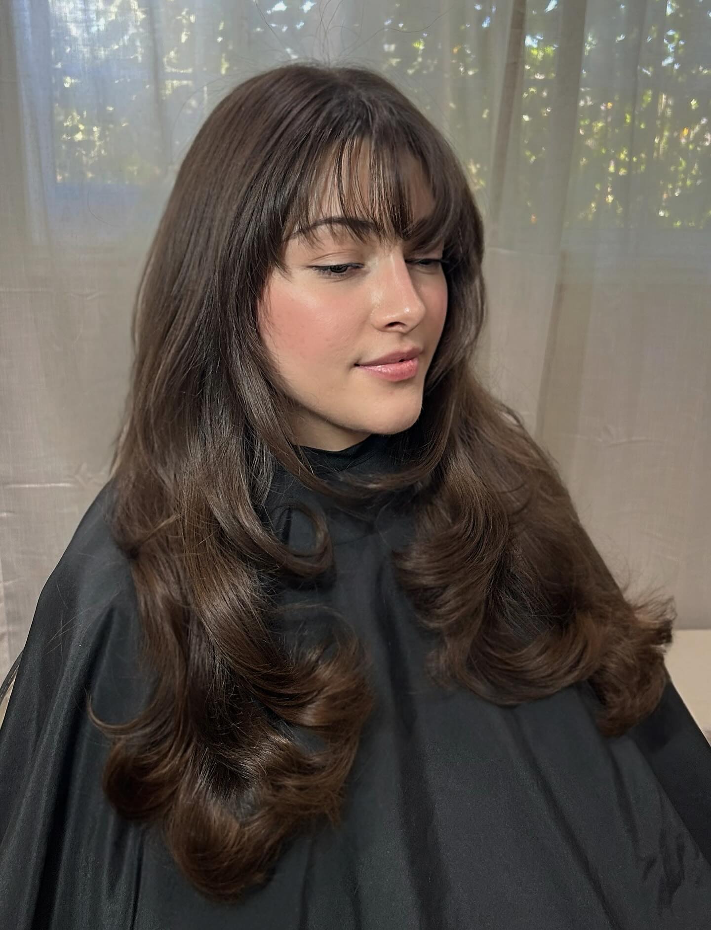Soft Wispy Bangs with Luxurious Layered Waves