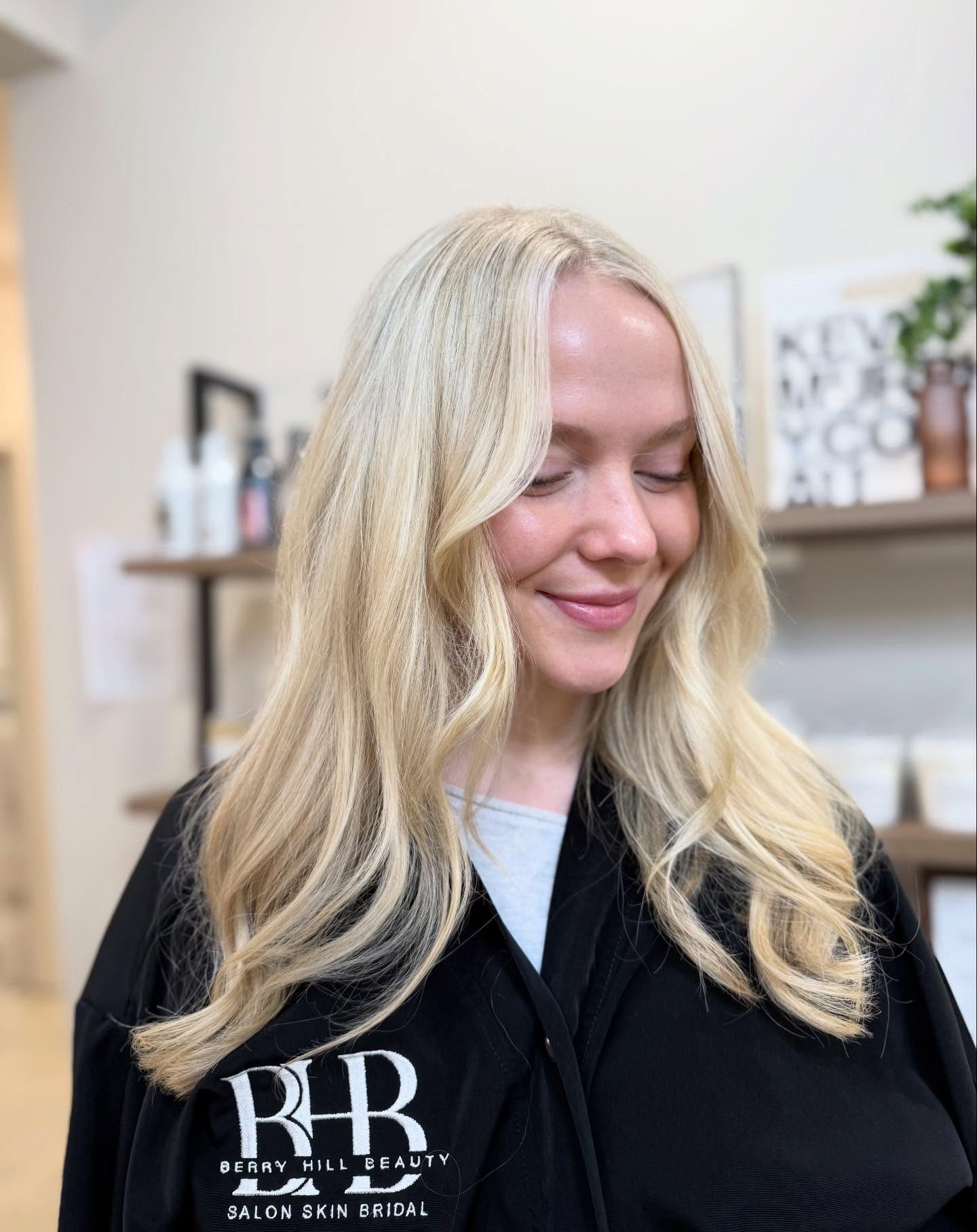 Softly Layered Bright Blonde Long Hair with Gentle Waves