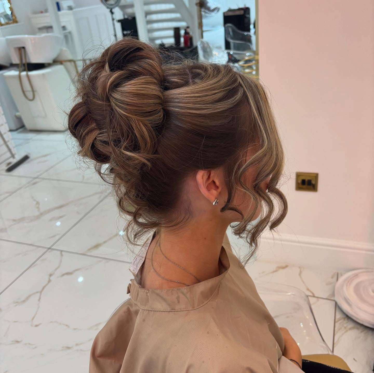 Stylish Curly Updo with Face-Framing Tendrils