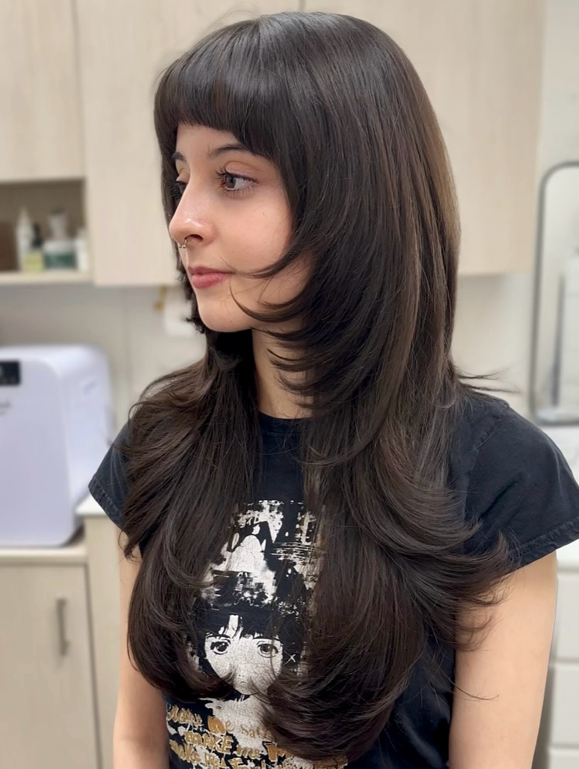 Stylish Long Layered Cut with Wispy Bangs
