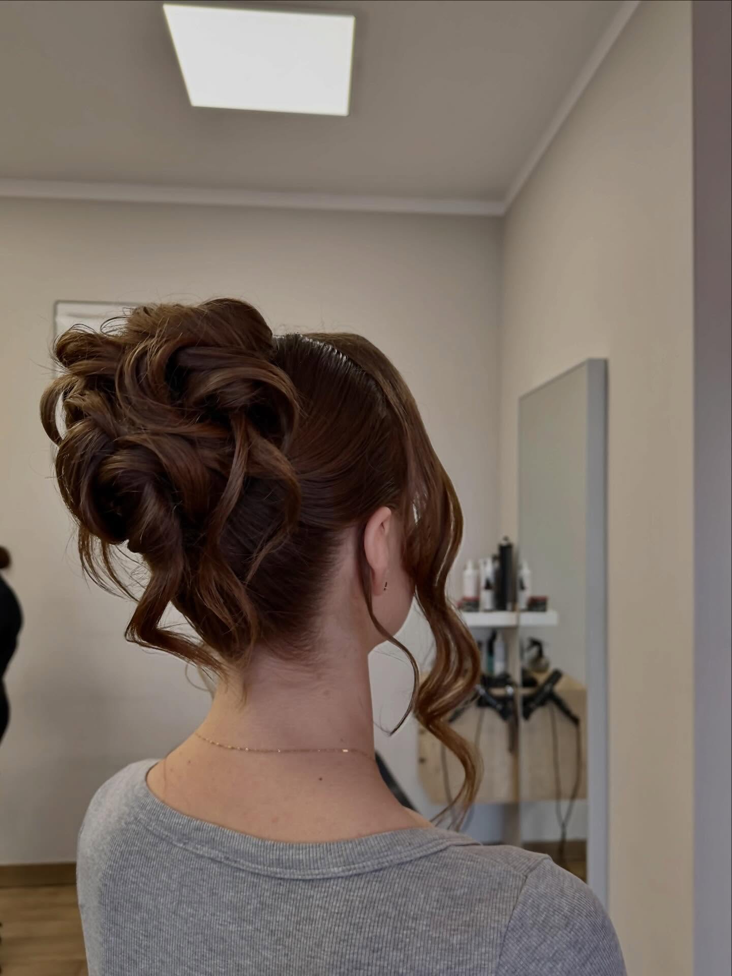 Stylish Messy Bun with Soft Cascading Curls