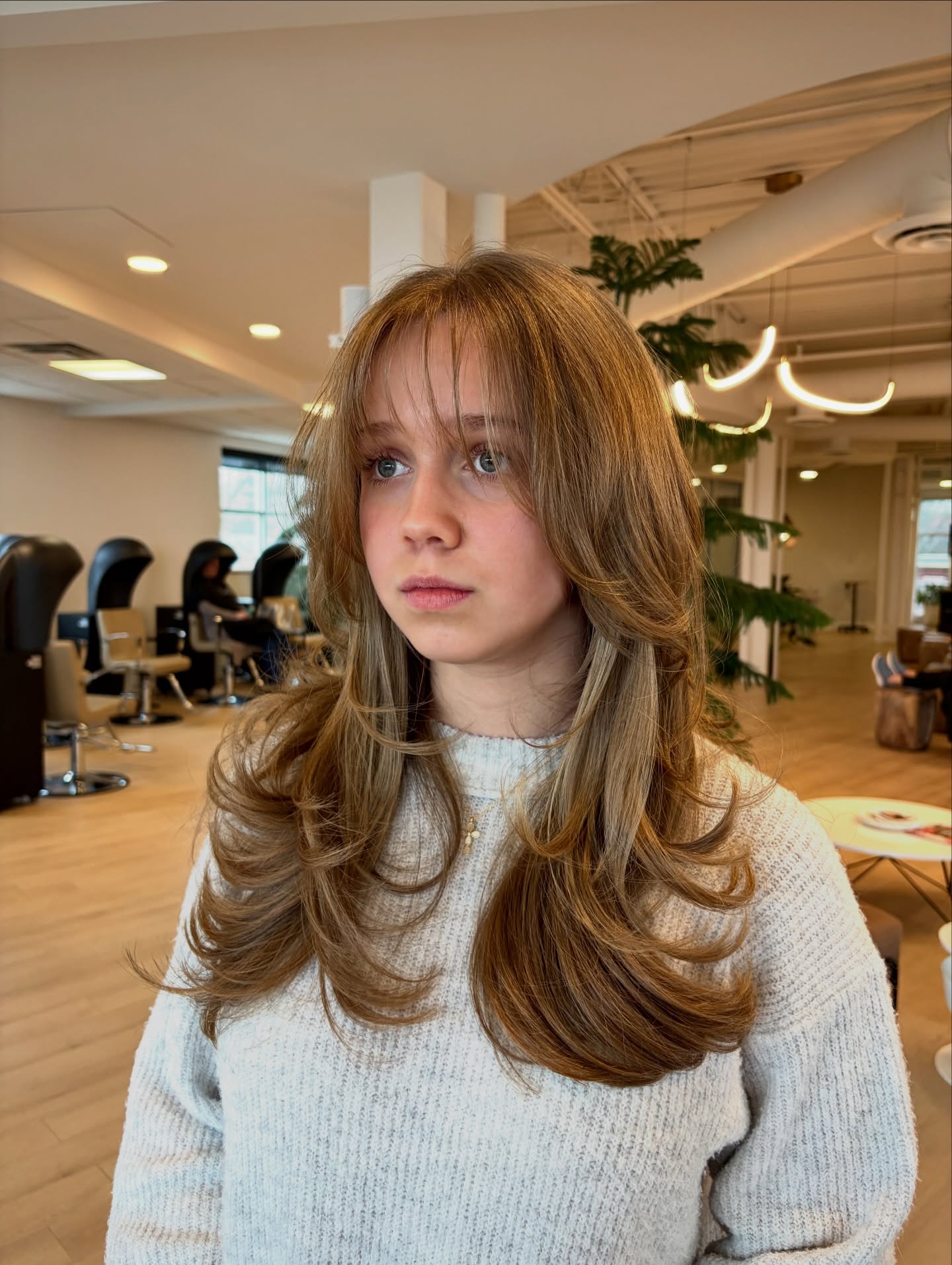 Trendy Wispy Bangs with Layered Face-Framing Strands