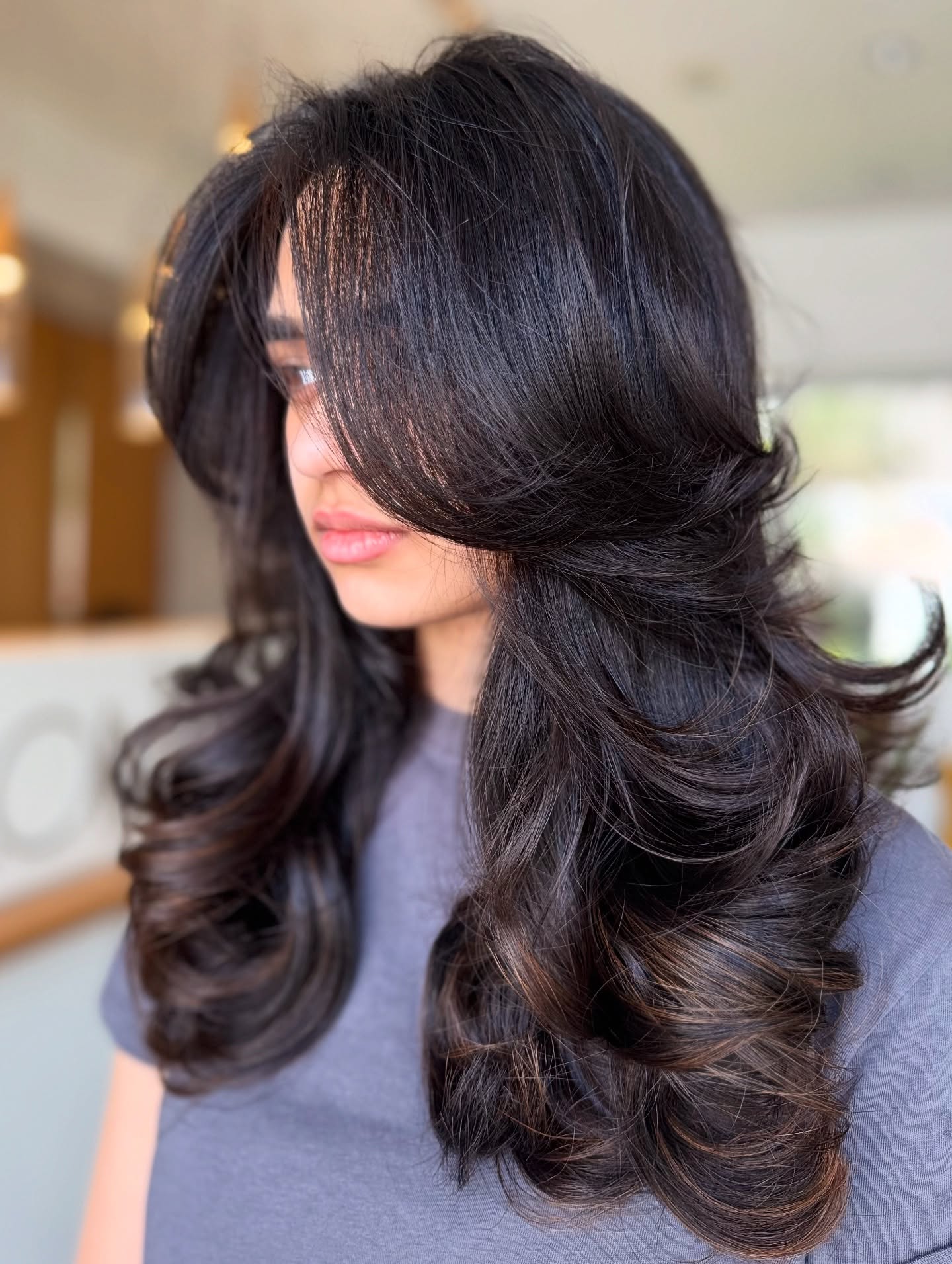 Voluminous Layered Cut with Soft Face Framing