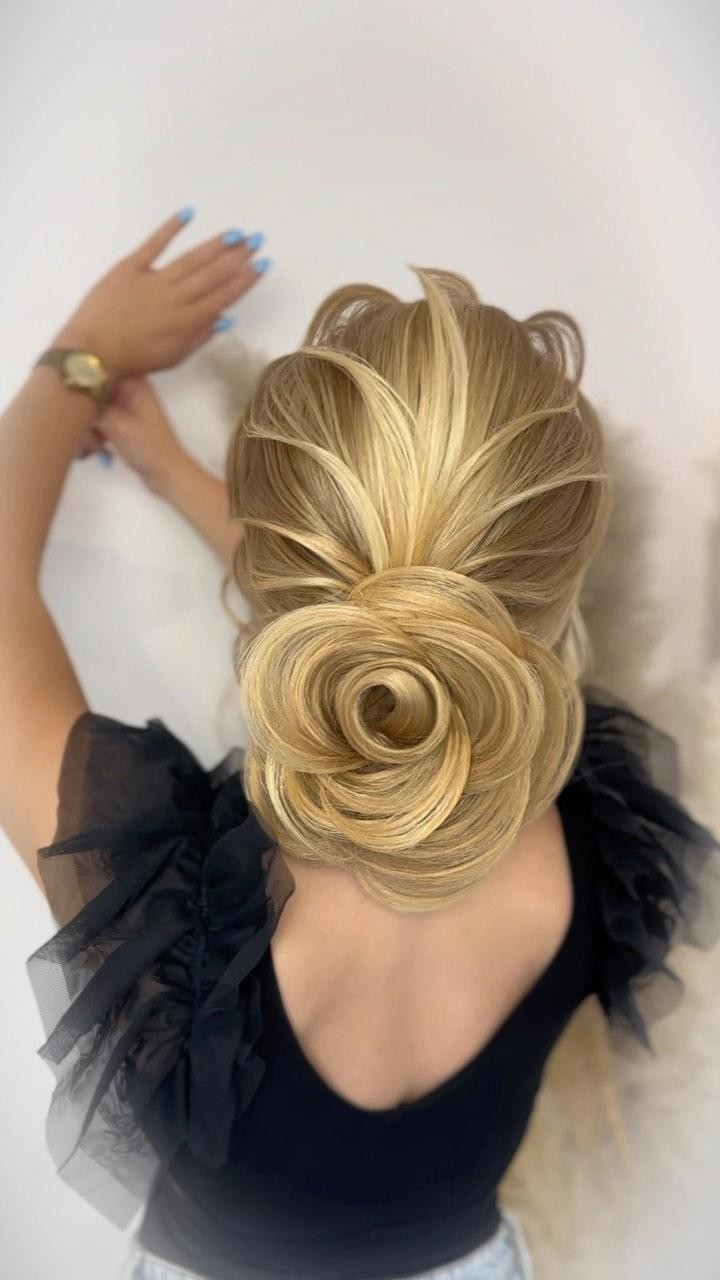 Whimsical Curled Low Bun with Textured Layers